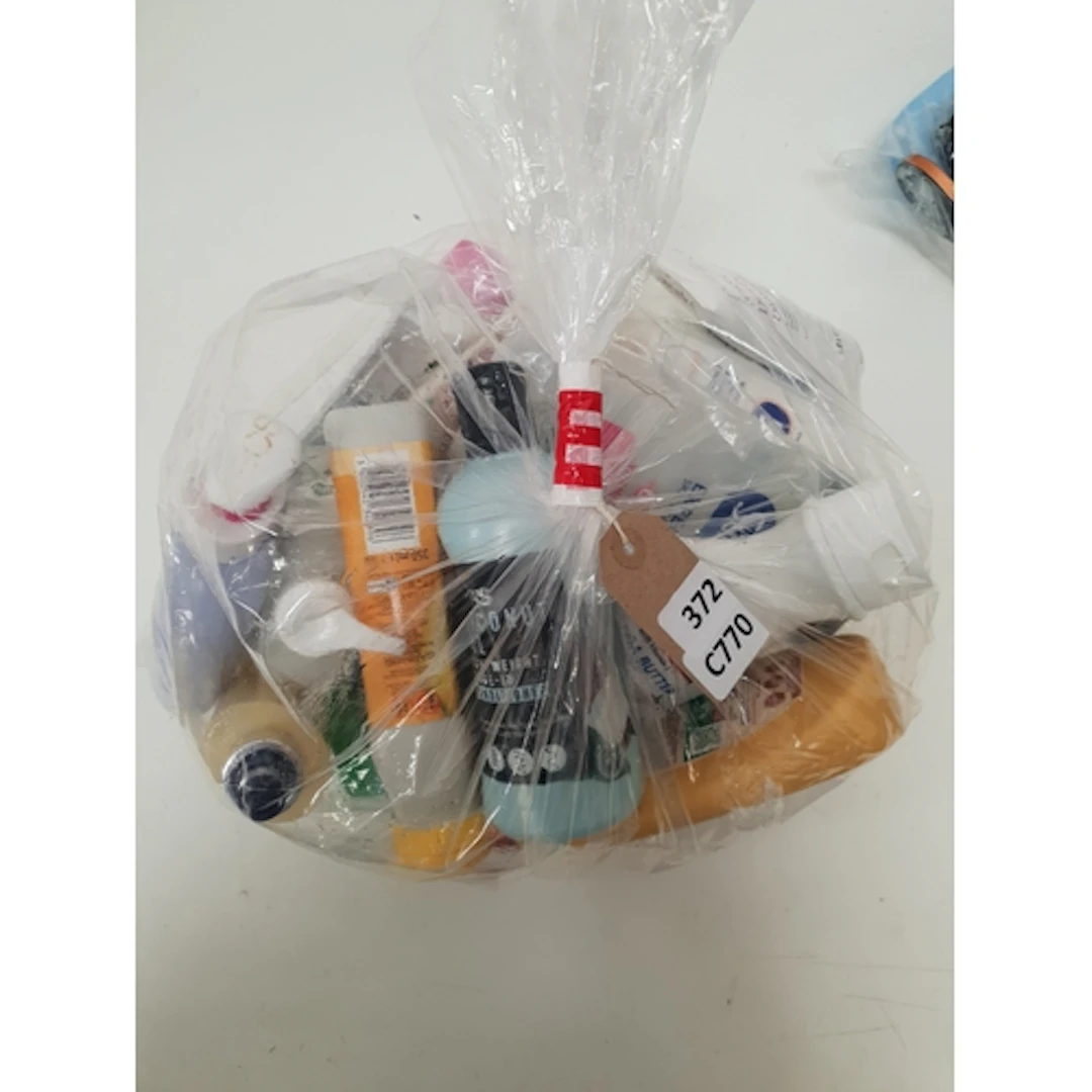 ONE BAG OF USED COSMETICS including Garnier and Palmers