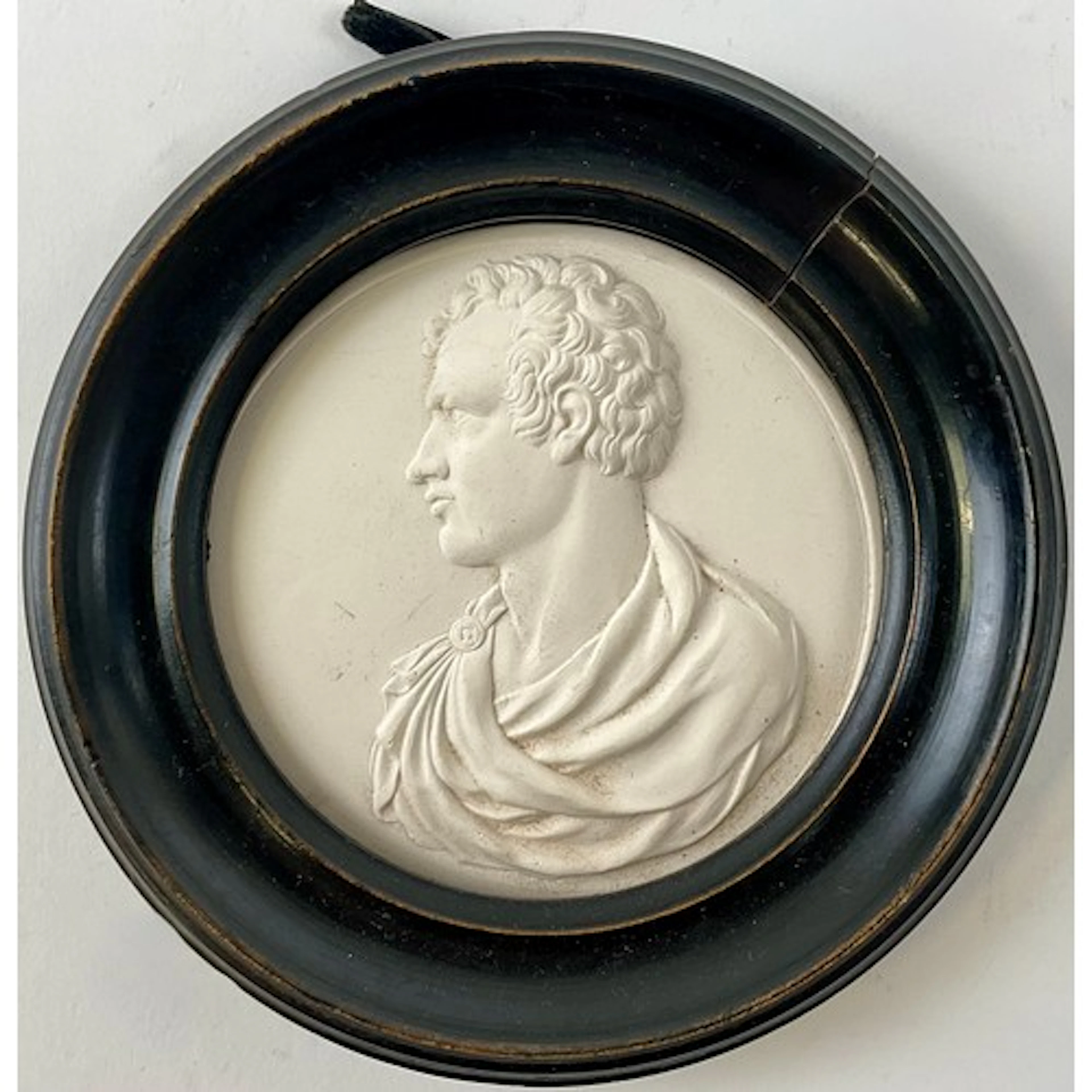 A plaster intaglio medallion, cast with a portrait bust of L...
