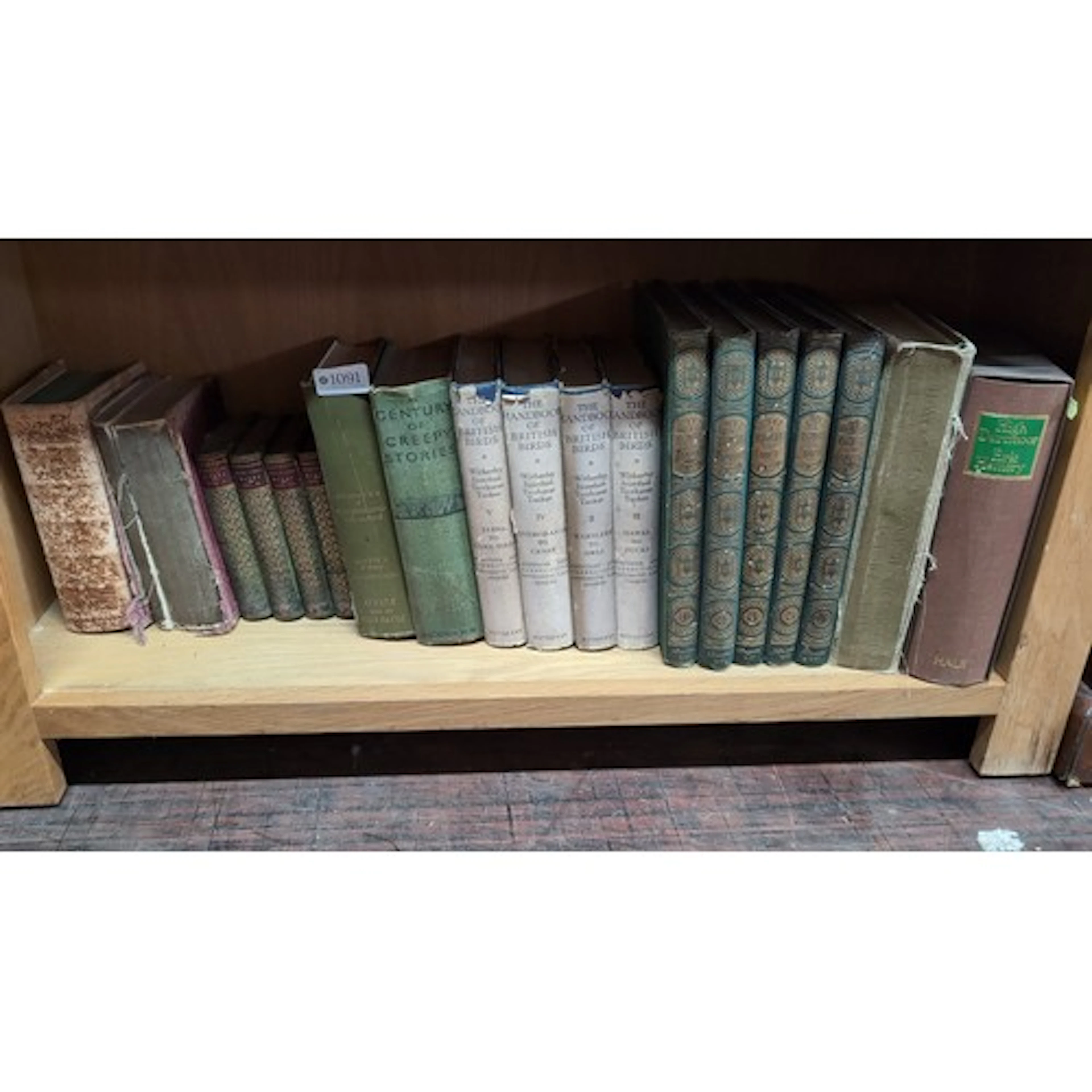 An assortment of vintage cloth- and leather-bound books, inc...
