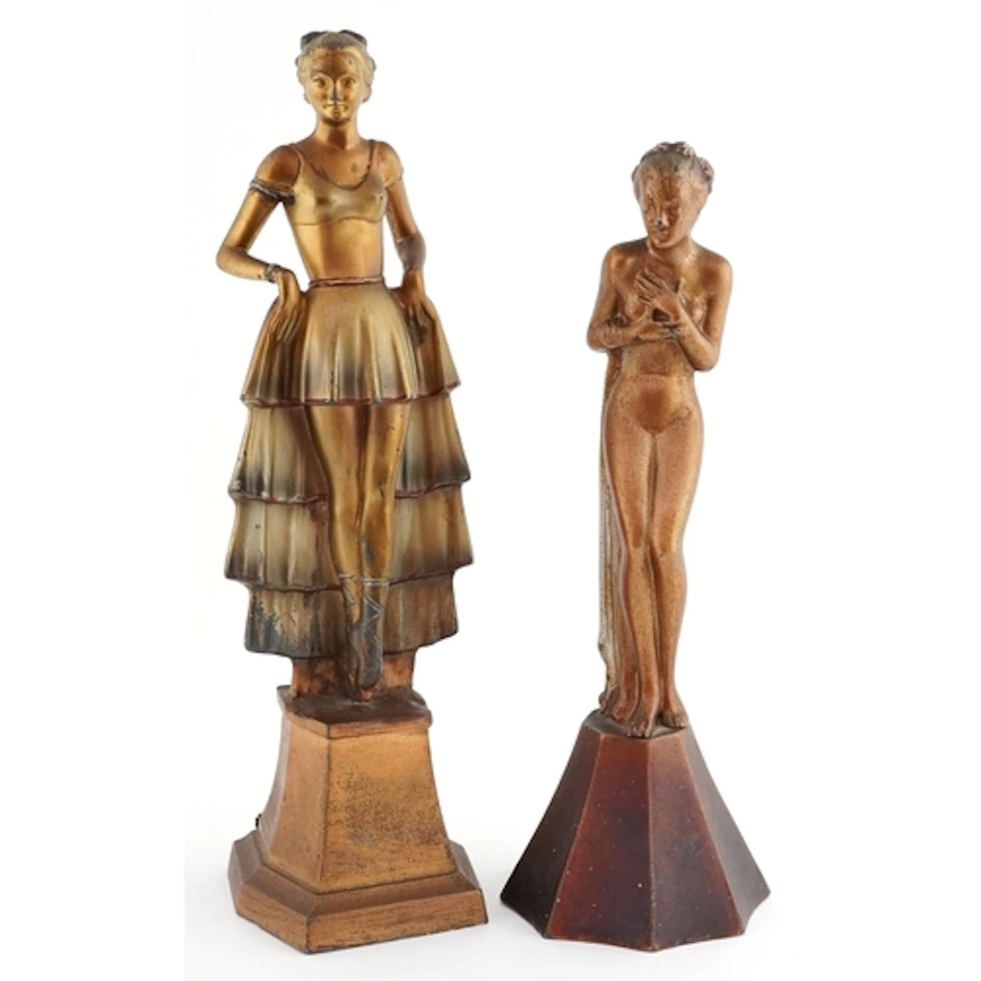 Two Art Deco bronzed spelter figures of young females in the...