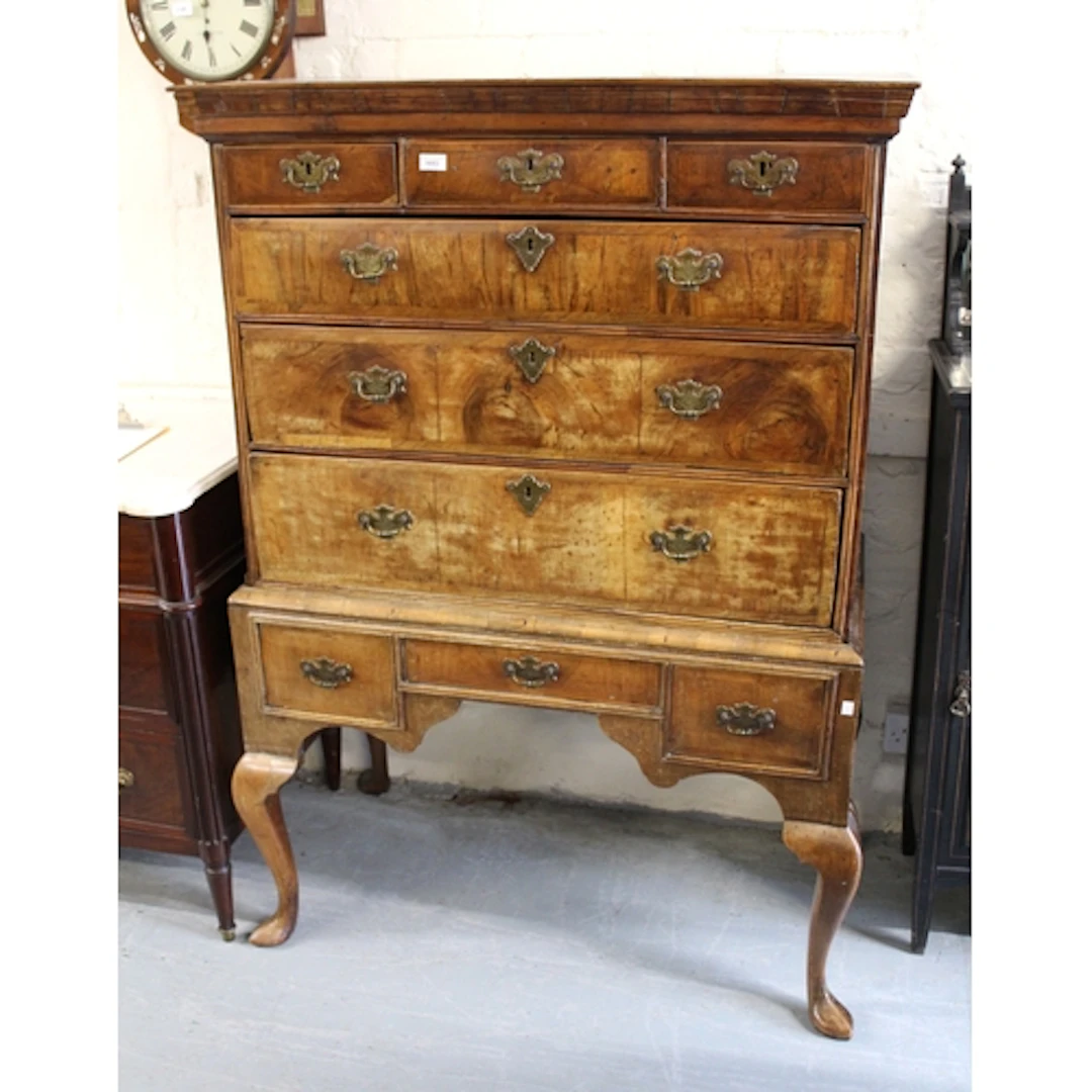 Early 18th Century walnut chest on stand, the moulded cornic...