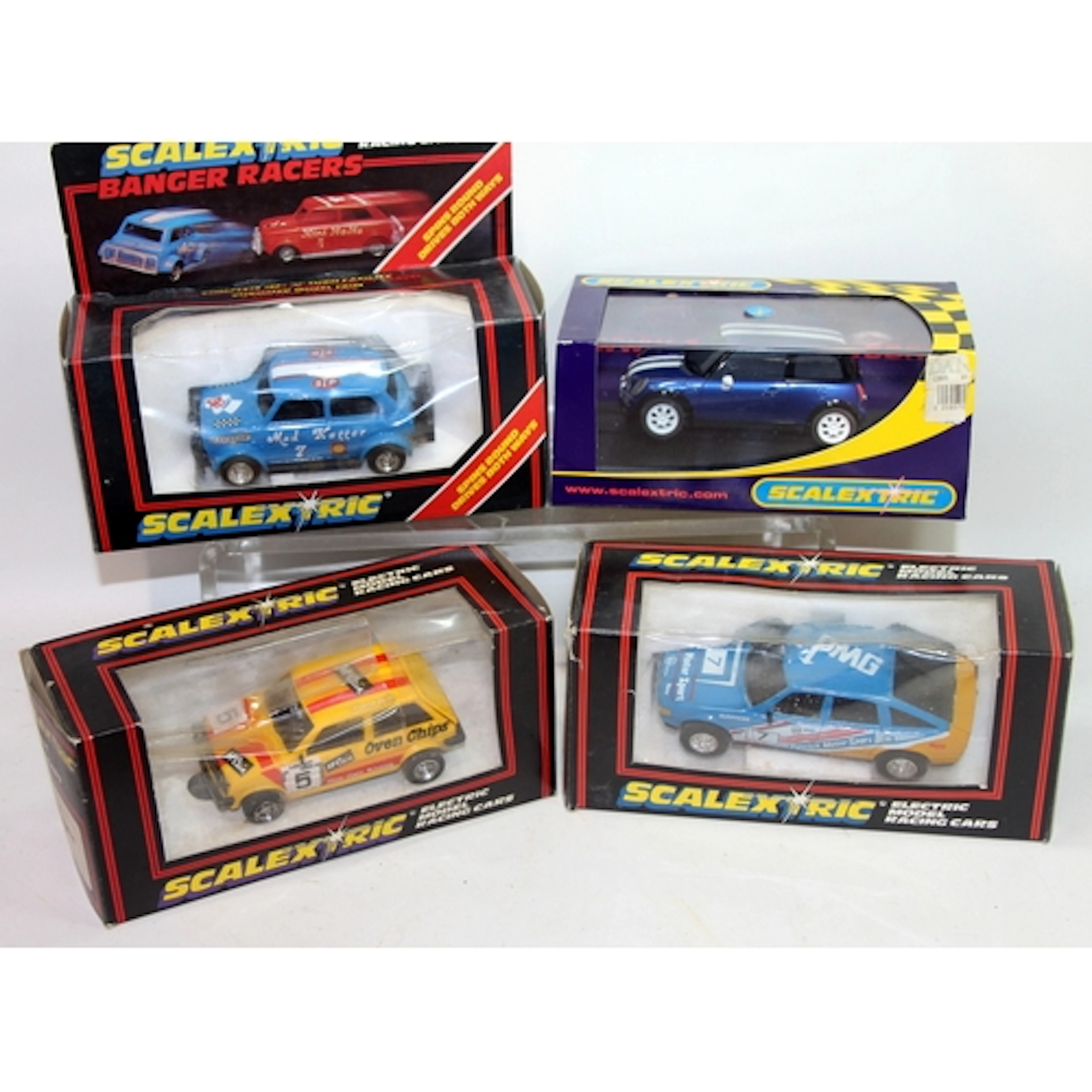 A collection of Scalextric slot car racing vehicles includin...