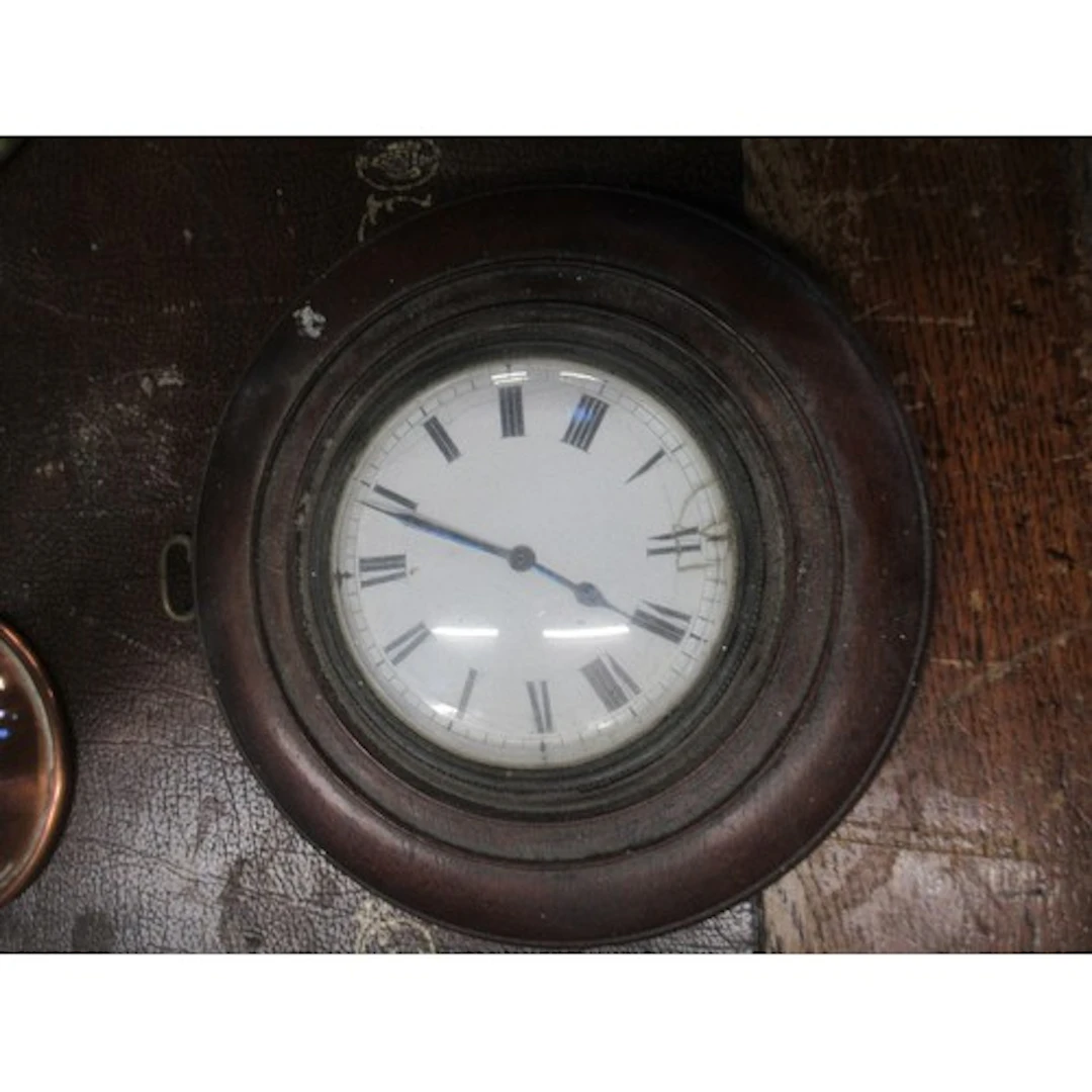 A 19th century clock, with mahogany mount