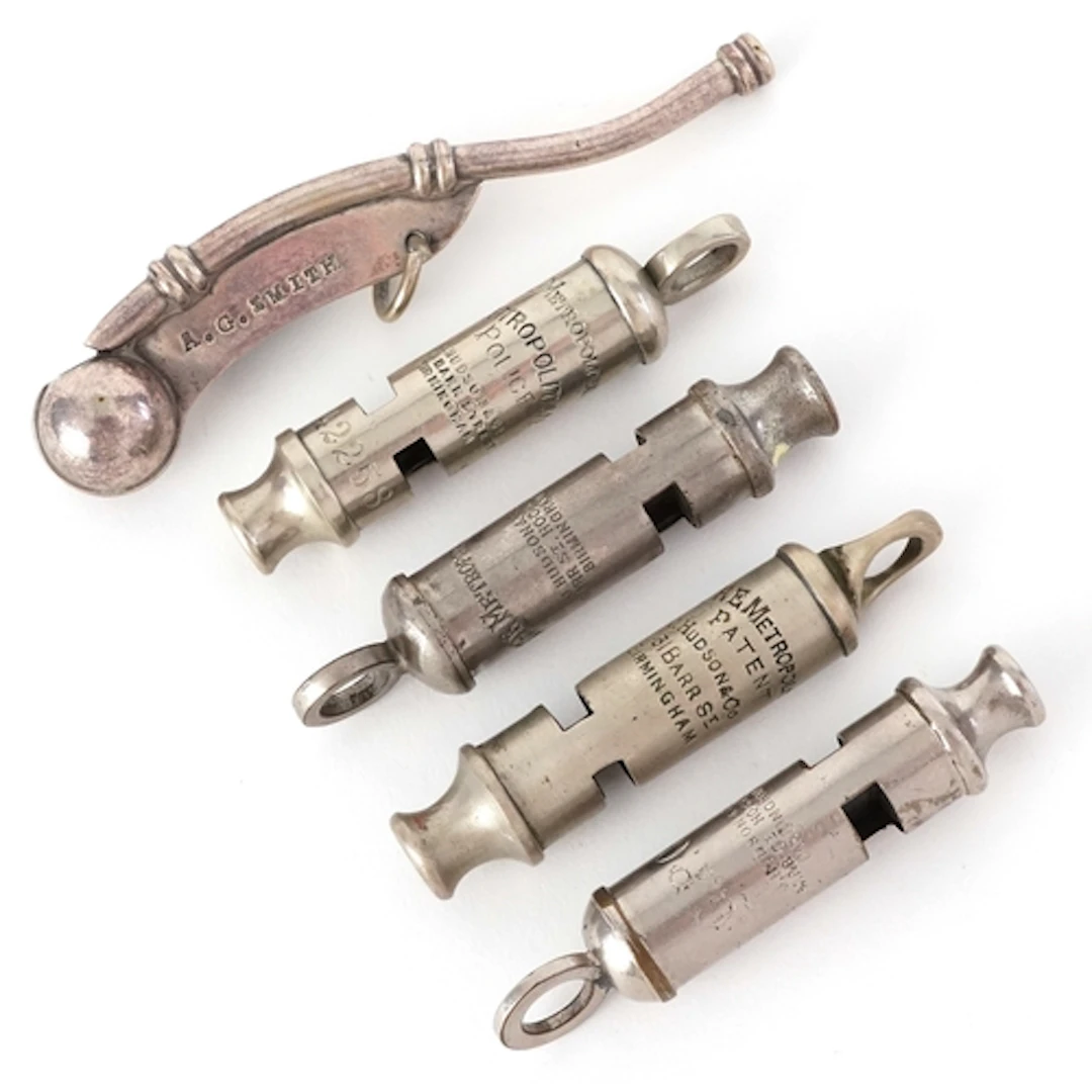 Five vintage whistles comprising a bosun's whistle, three J ...