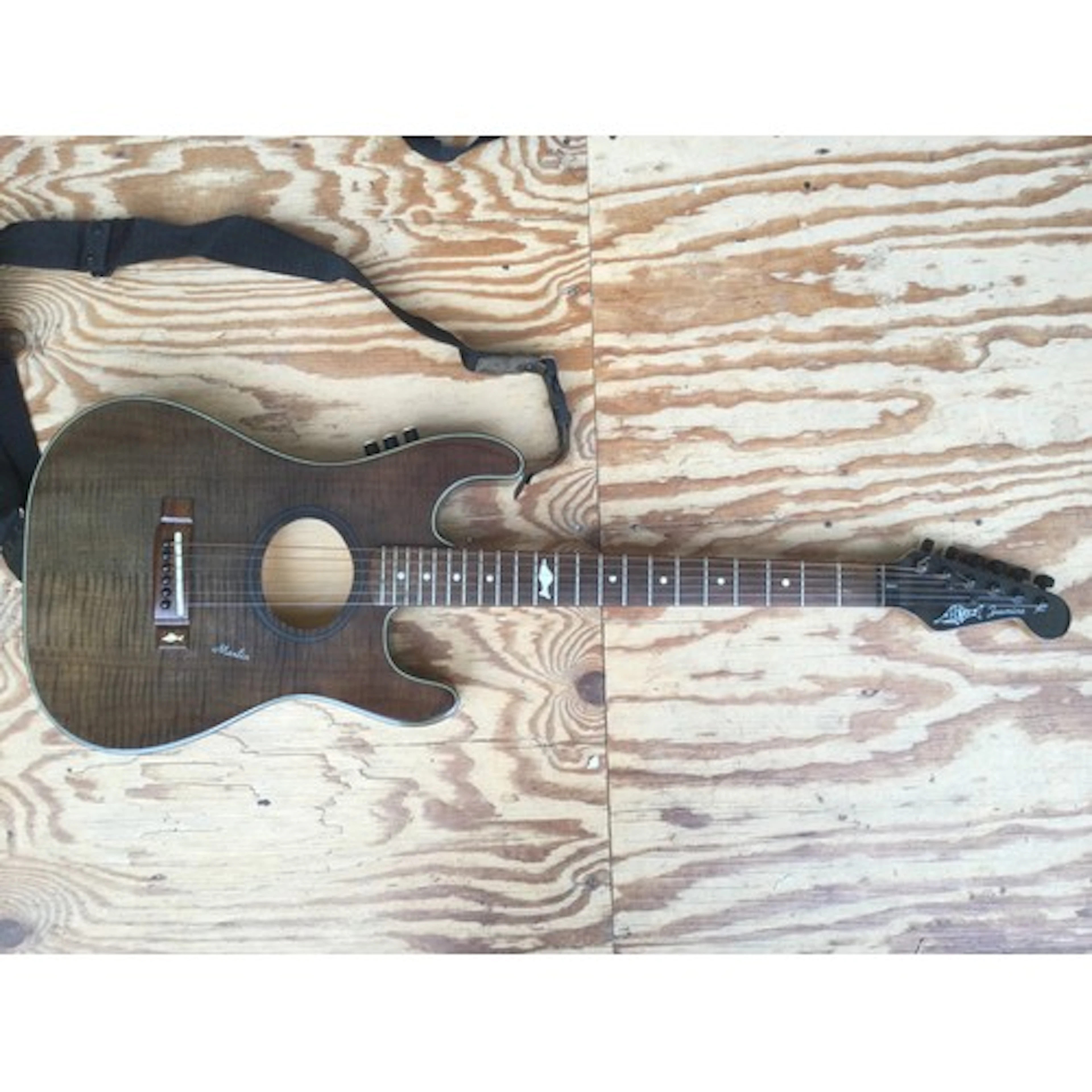 A Marlin Jasmine electro acoustic guitar. Comes with a soft ...