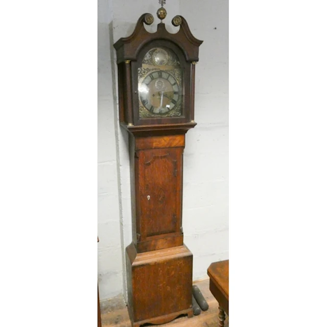 A Victorian eight day Grandfather clock in oak and mahogany ...