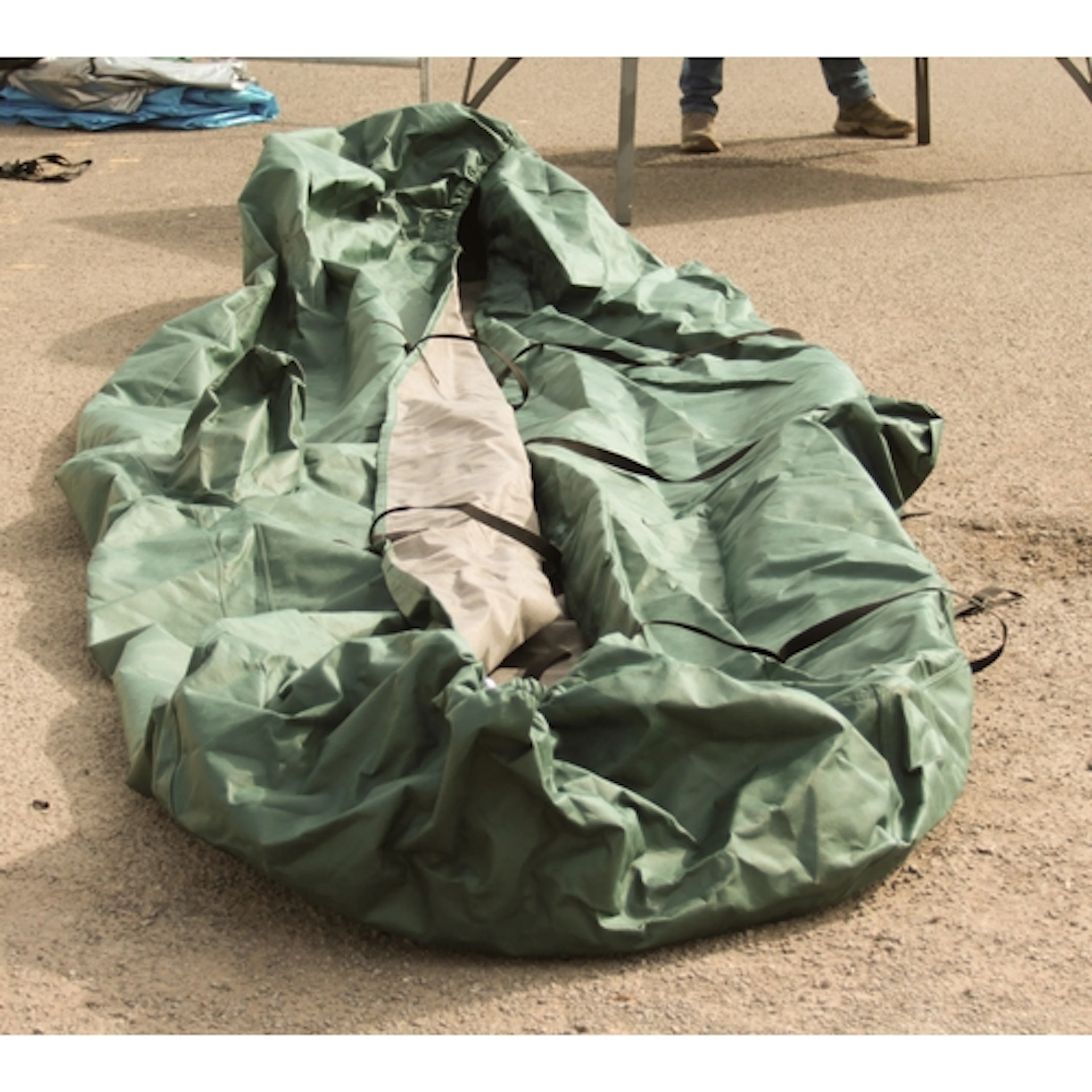 A green car cover - believed to be a custom fit cover for an...