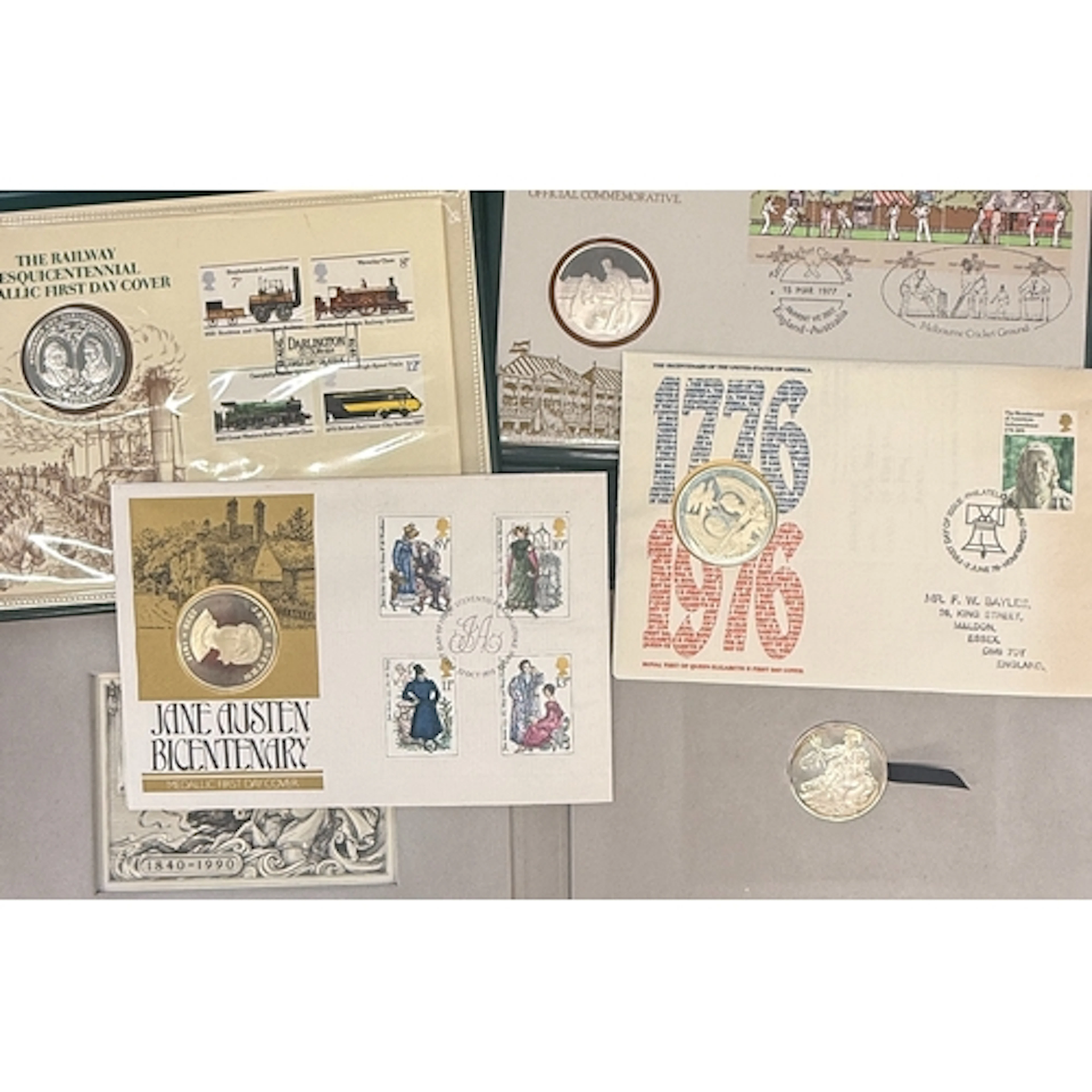 A group of eight Great Britain medallic stamp covers, each i...