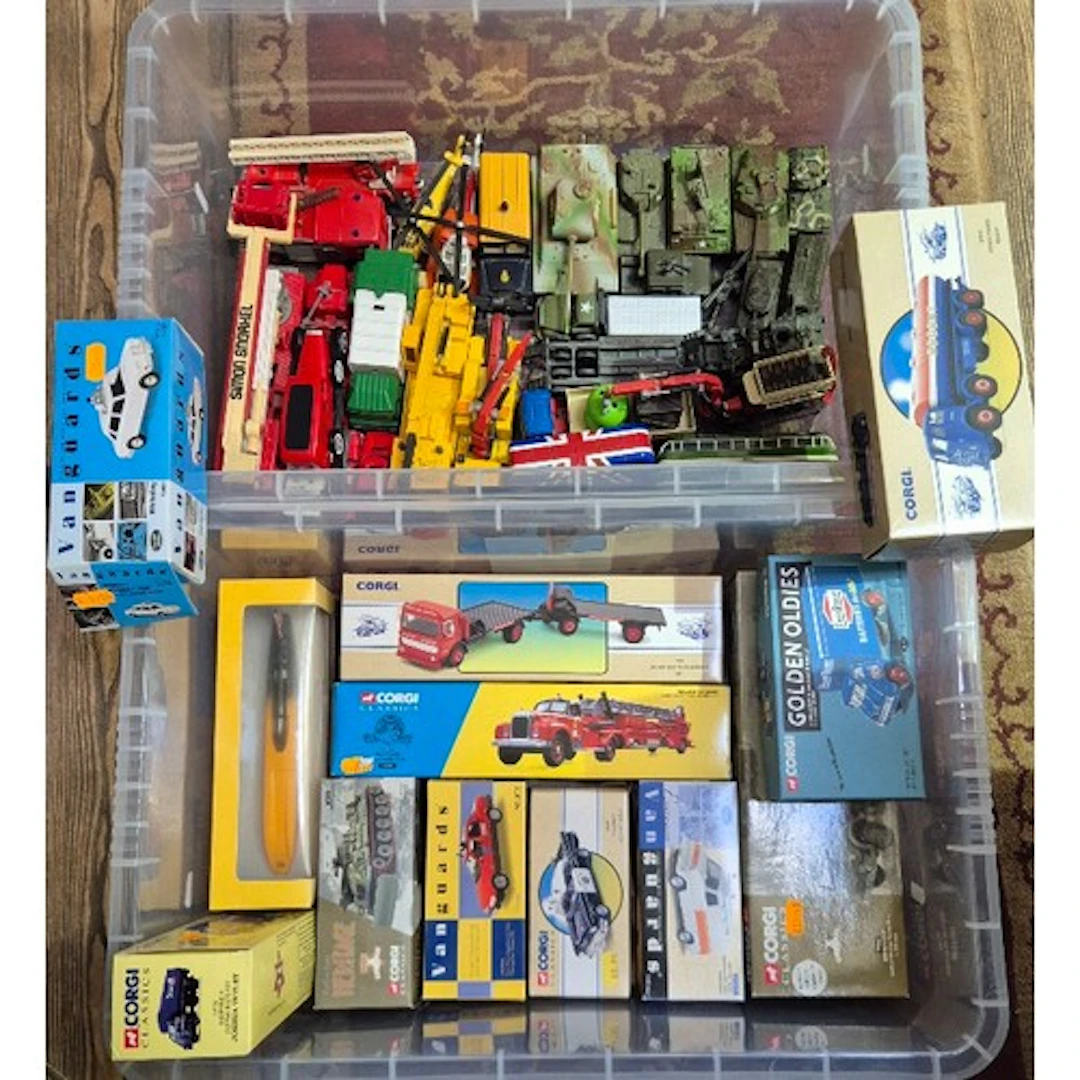Two boxes of assorted diecast model vehicles to include Corg...