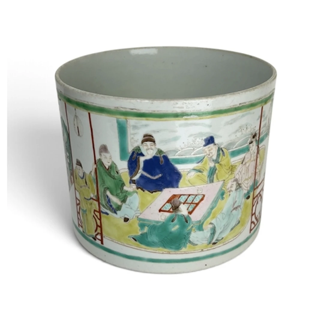 A CHINESE FAMILLE VERTE BRUSH POT Depicting sages and other ...