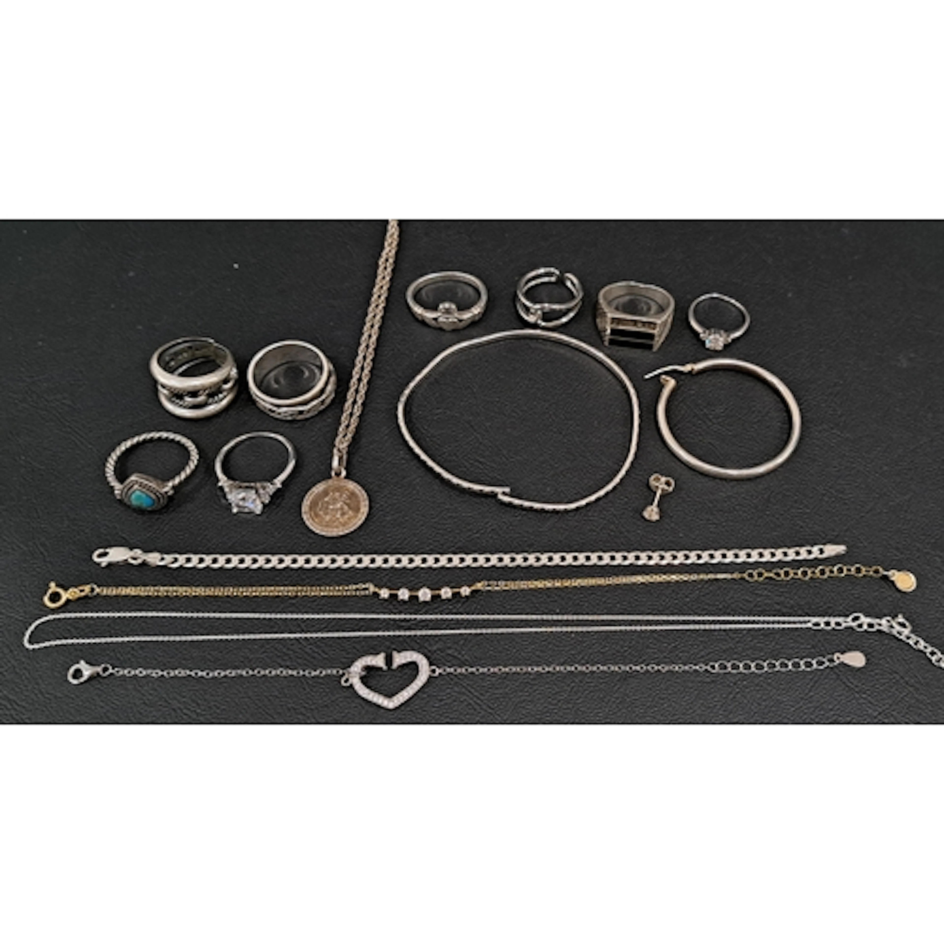 SELECTION OF SILVER JEWELLERY comprising eight various rings...