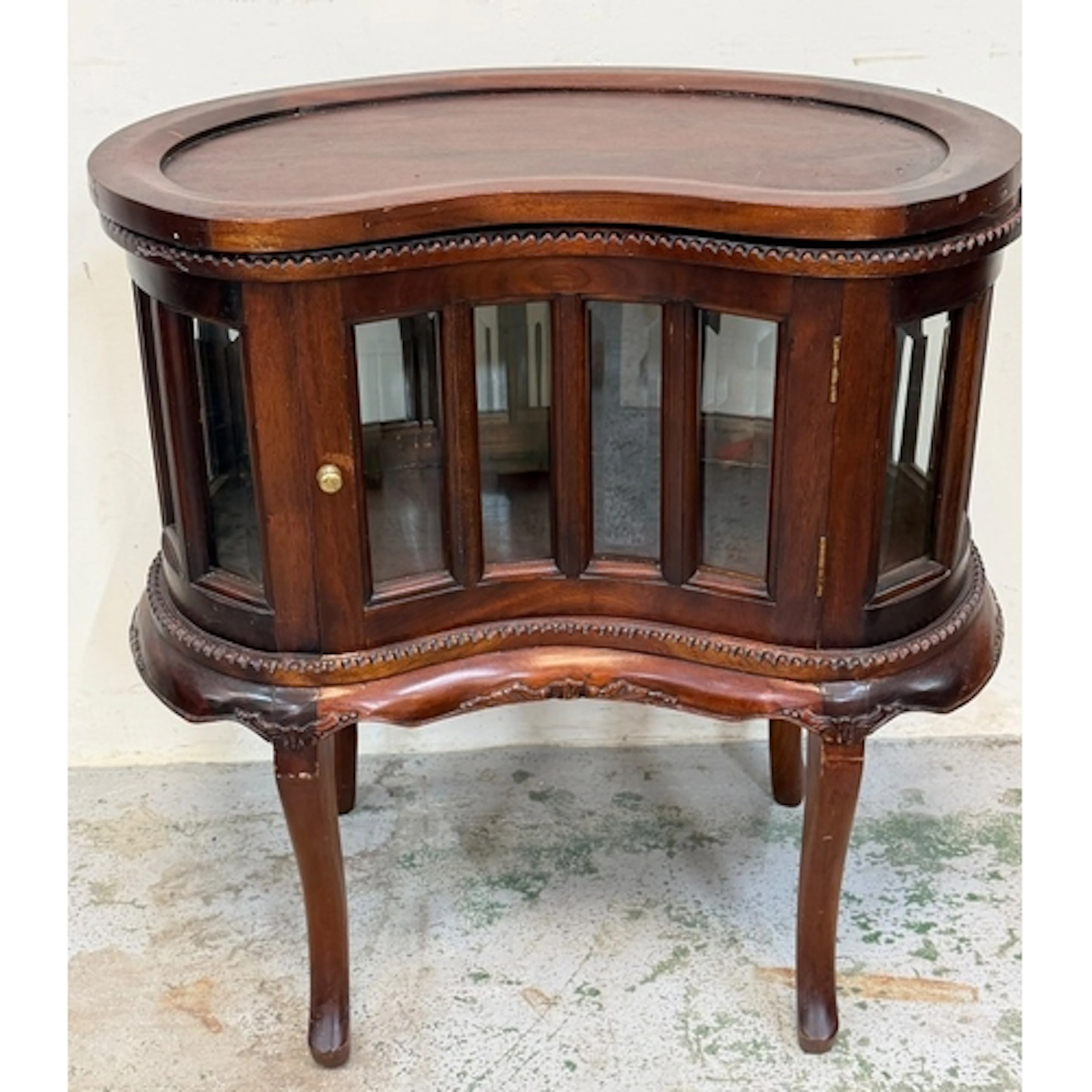 Kidney-shaped display cabinet on legs