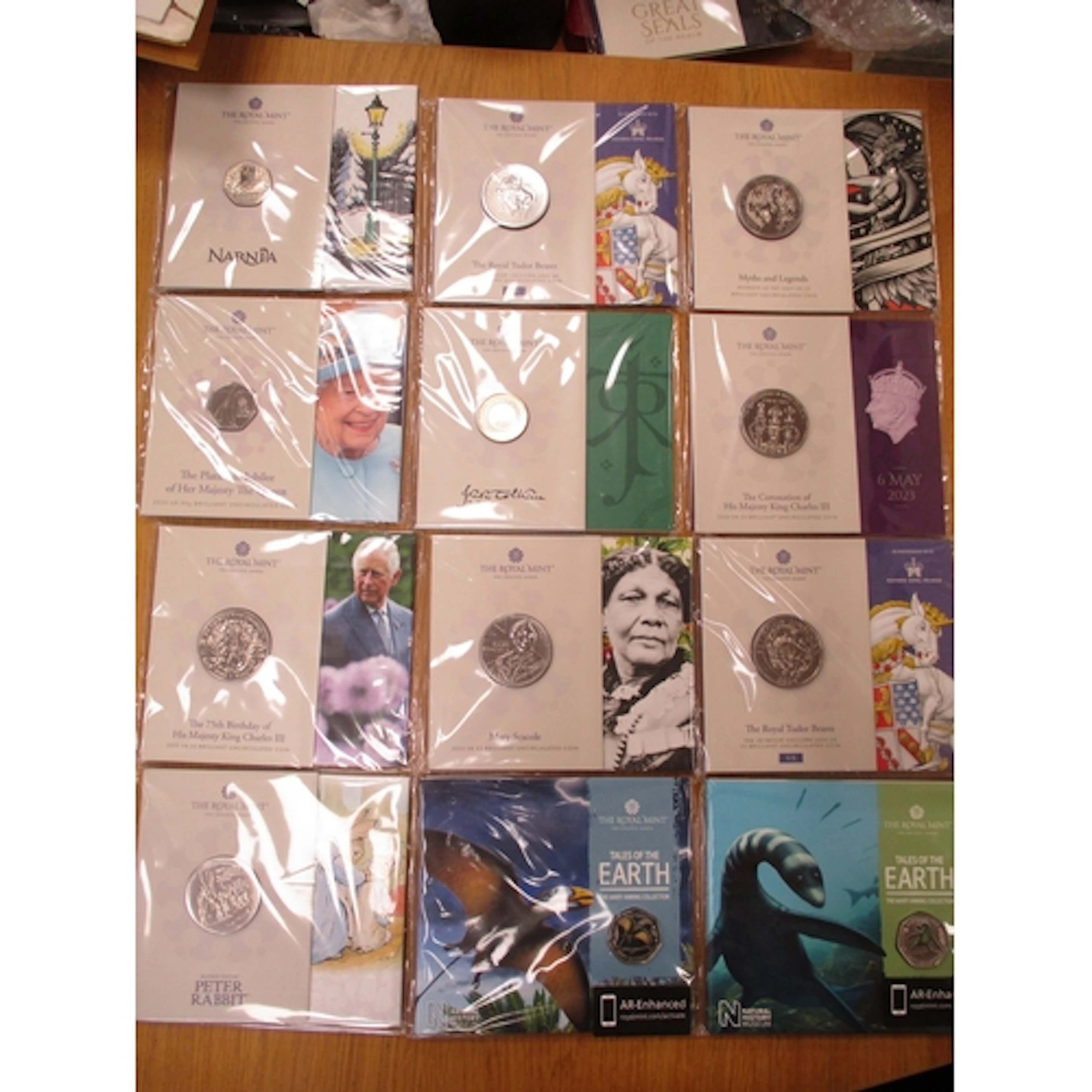 Collection of Royal Mint uncirculated folders, including £5...