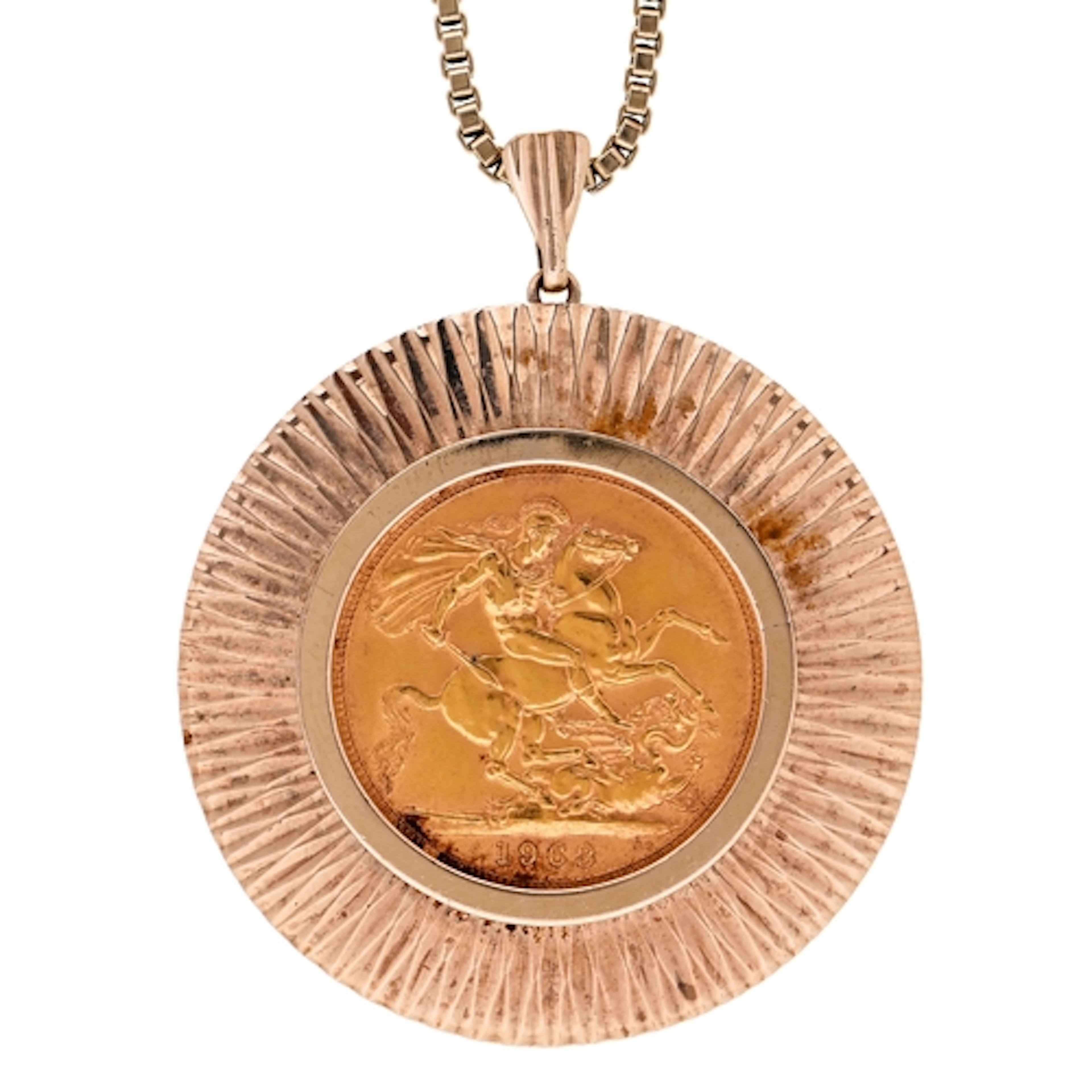 Gold coin. Sovereign 1963, mounted in a 9ct gold sun ray pen...