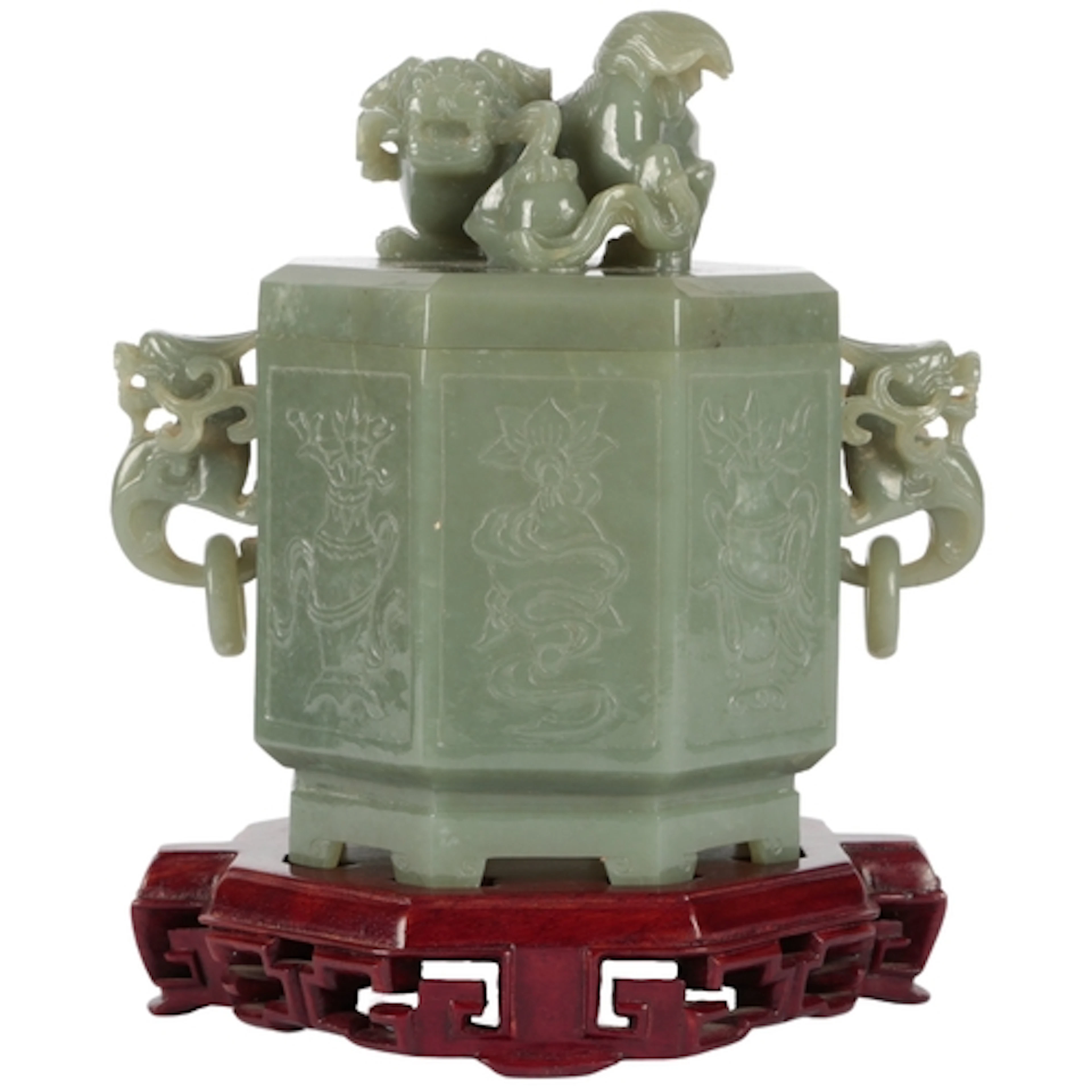 A large Chinese green jade 'auspicious objects' octagonal bo...
