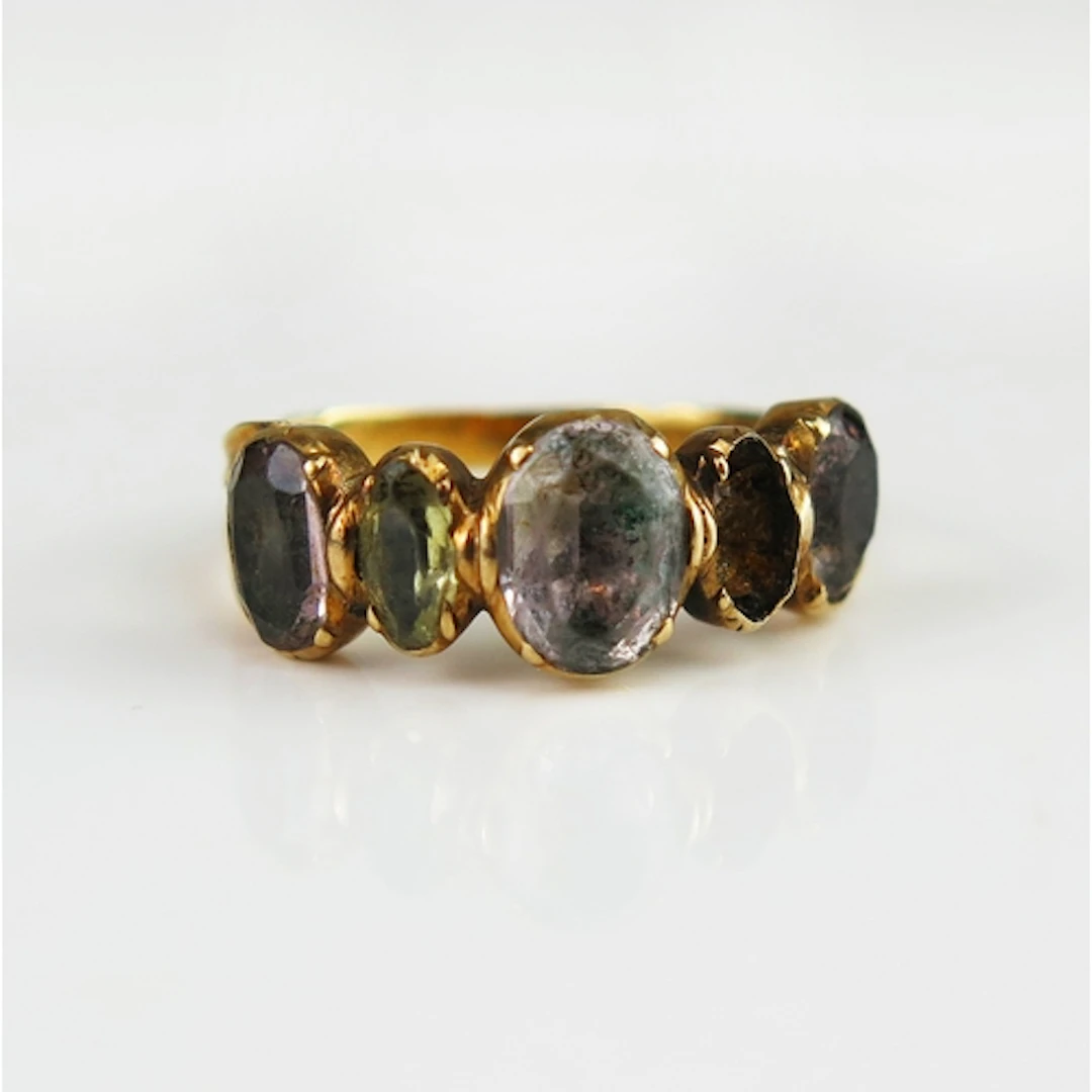 A Georgian foil backed paste ring in a high carat precious y...