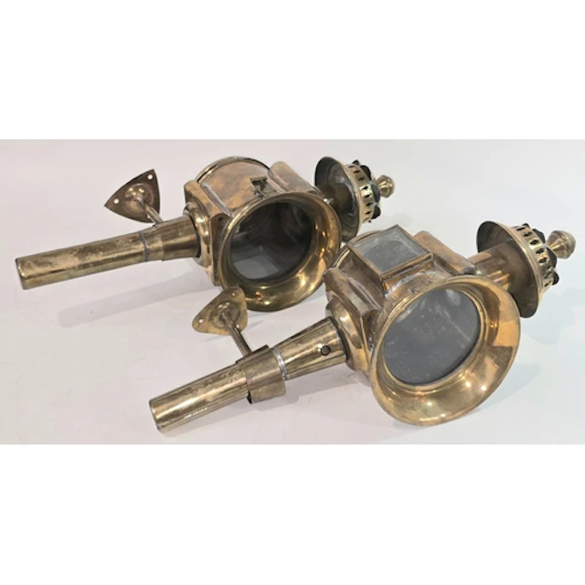 A pair of antique polished brass carriage/coaching lamps in ...