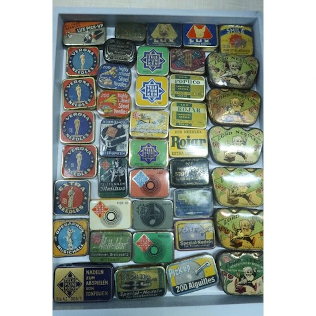 A tray of vintage gramophone needle tins