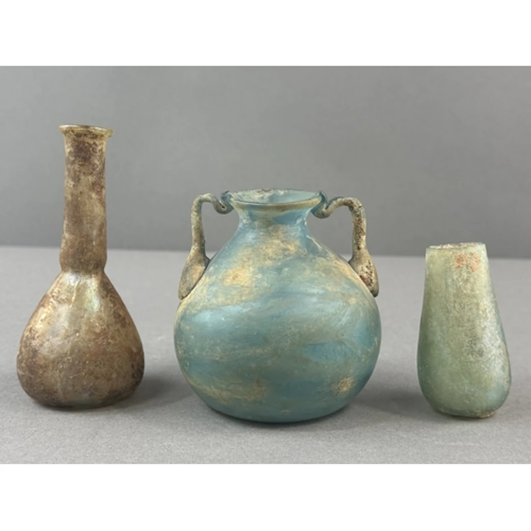 Decorative Arts: a Roman glass bottle of elongated pyriform ...