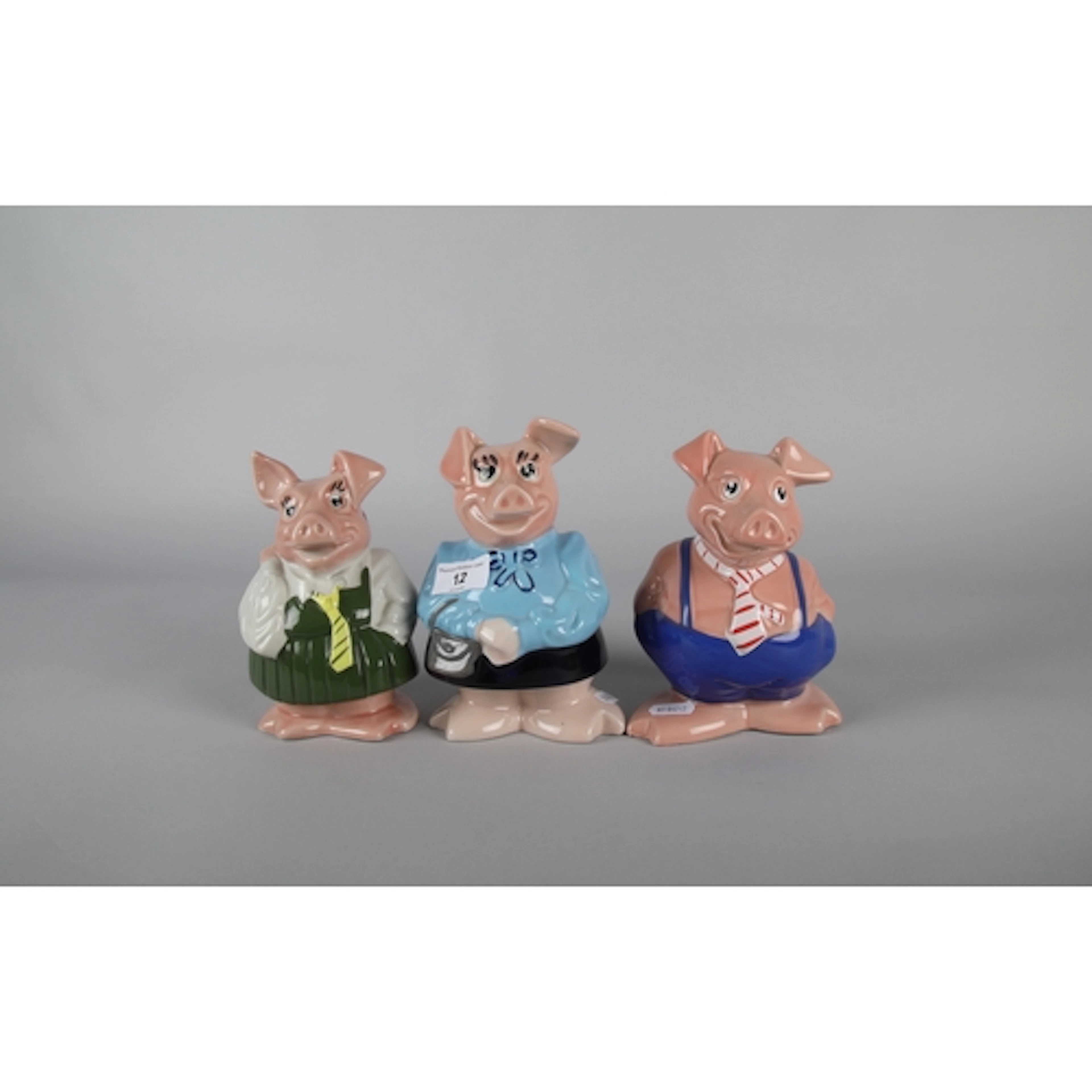 Three Natwest Wade novel character piggy banks.