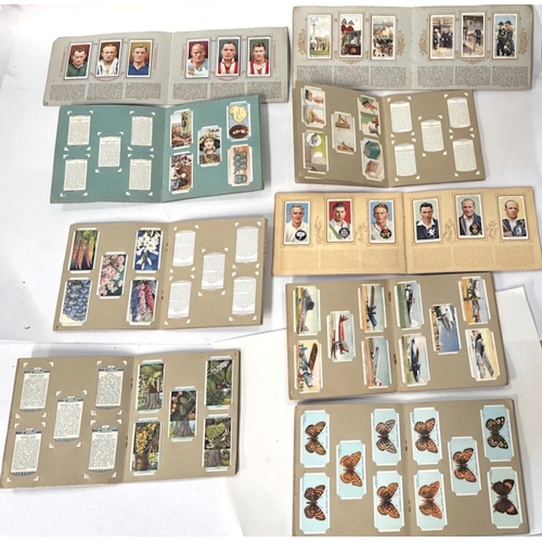 A collection of 40 booklets of vintage cigarette cards, many...
