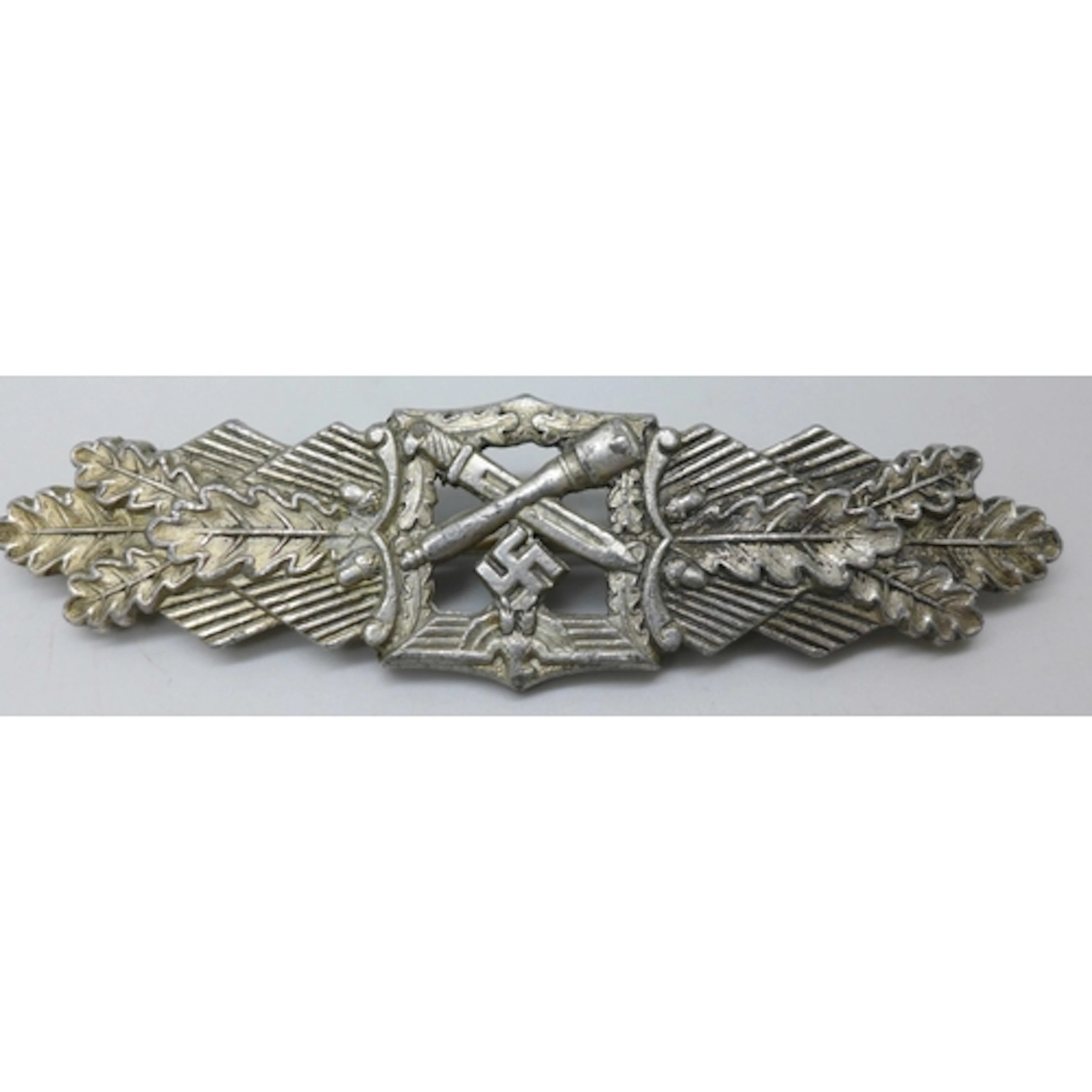 A German World War II badge, Close Combat Clasp, designed by...