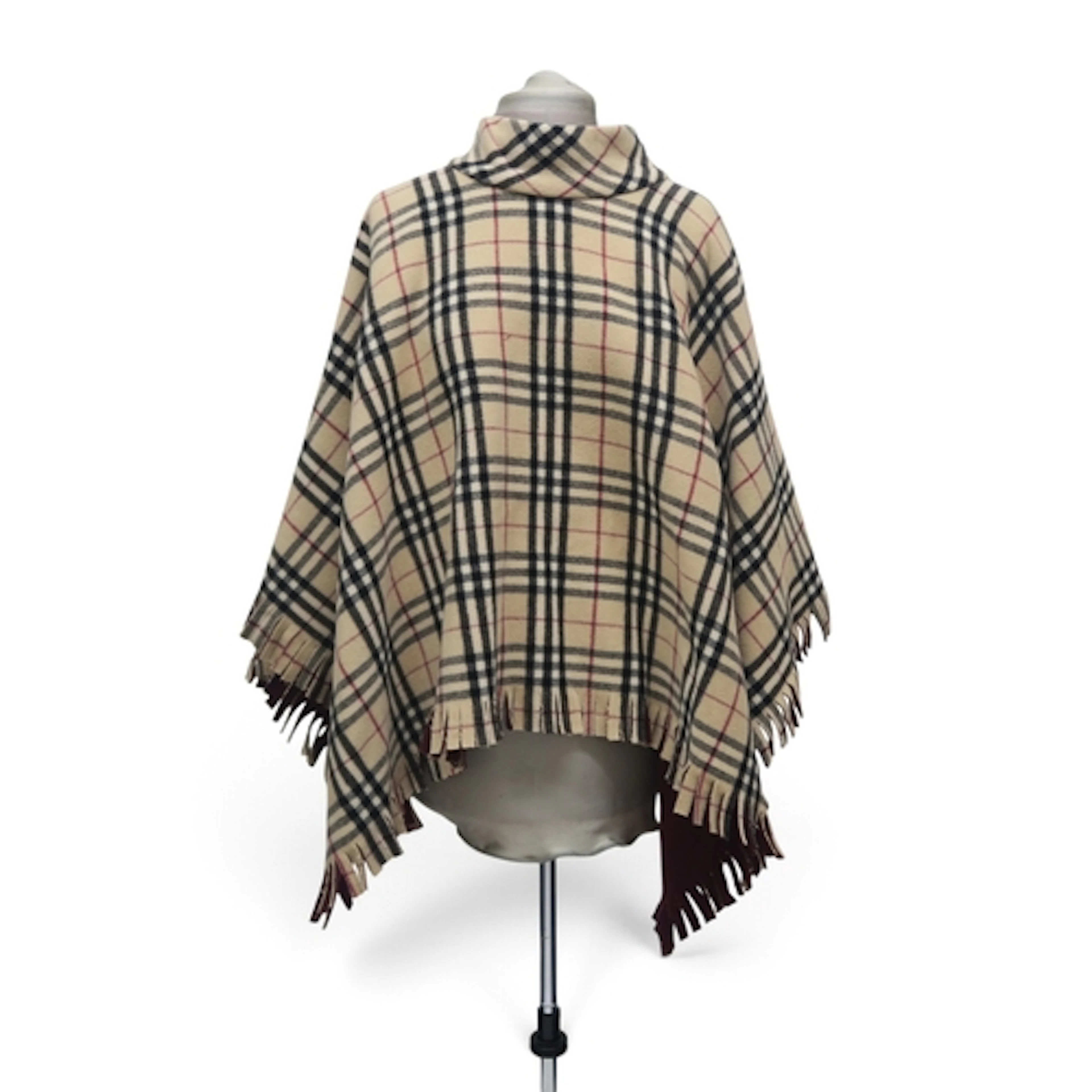 A Burberry wool poncho in light nova check with burgundy bac...