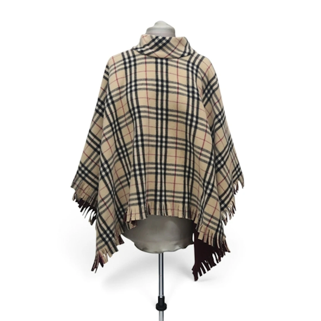 A Burberry wool poncho in light nova check with burgundy bac...