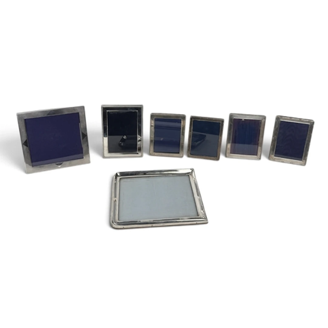 A GROUP OF SEVEN SILVER MOUNTED PHOTO FRAMES To include Aspr...