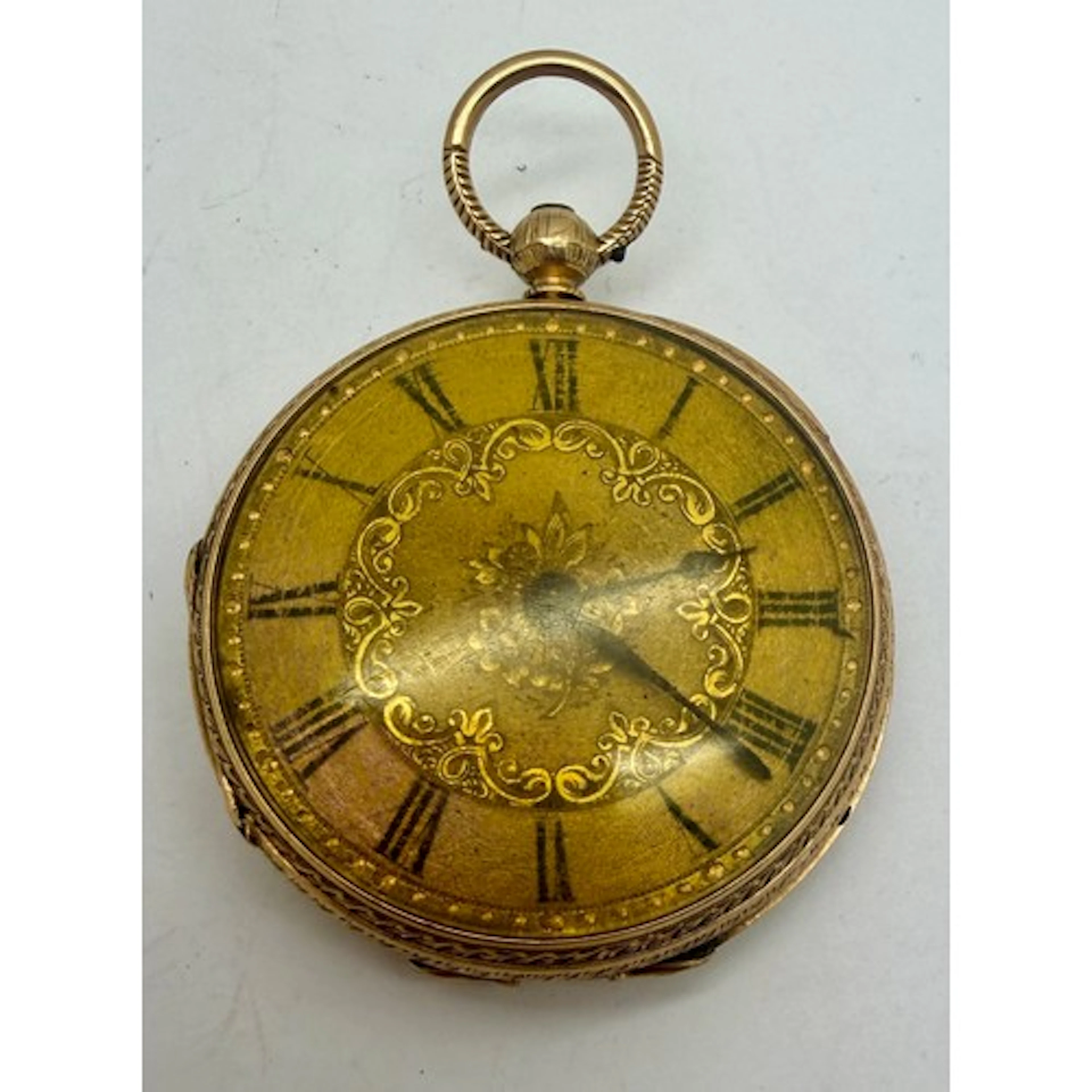 An 18 carat gold pocket watch. 4cm d. Weight 52.3gm.