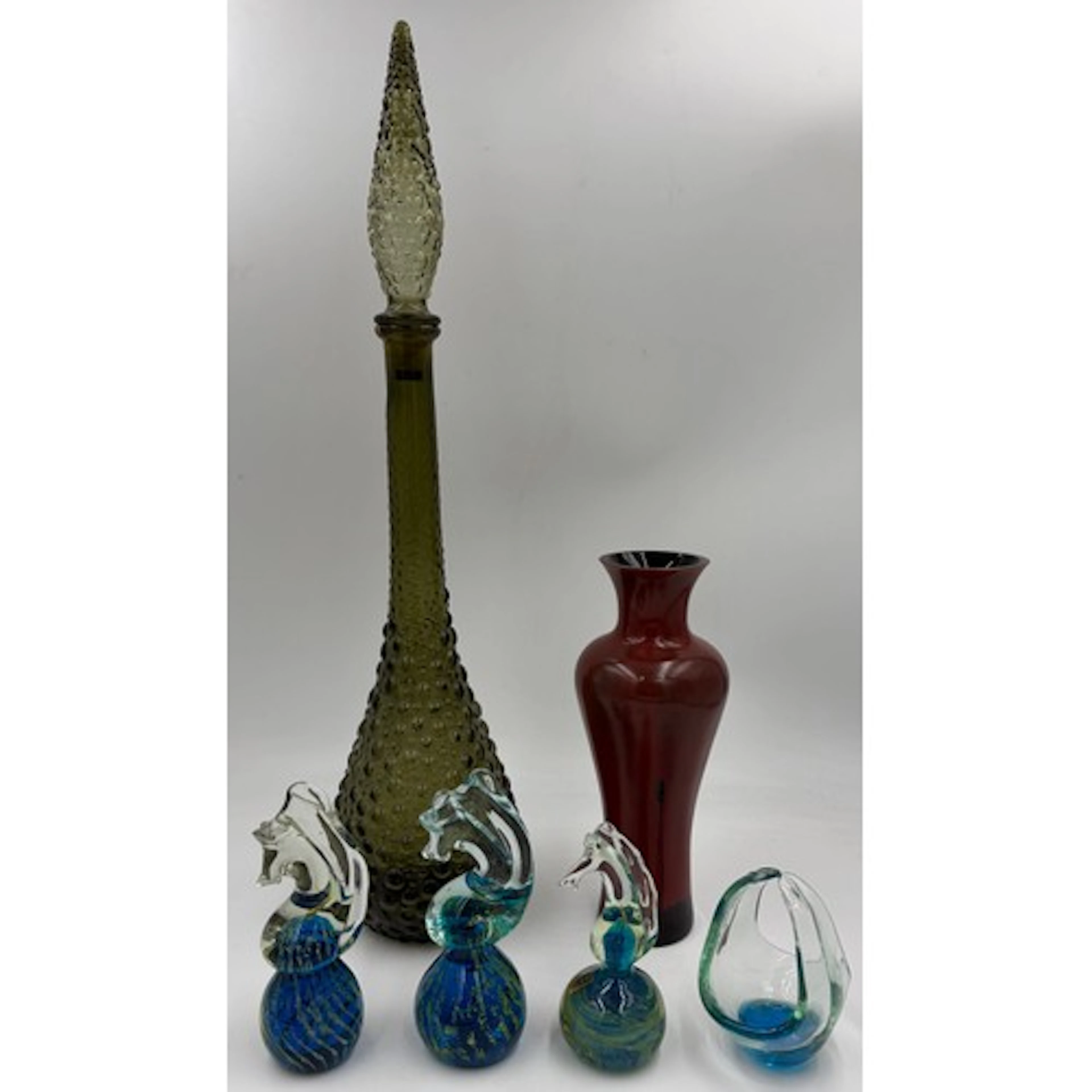 A collection of glass to include 3 Mdina paperweight seahors...