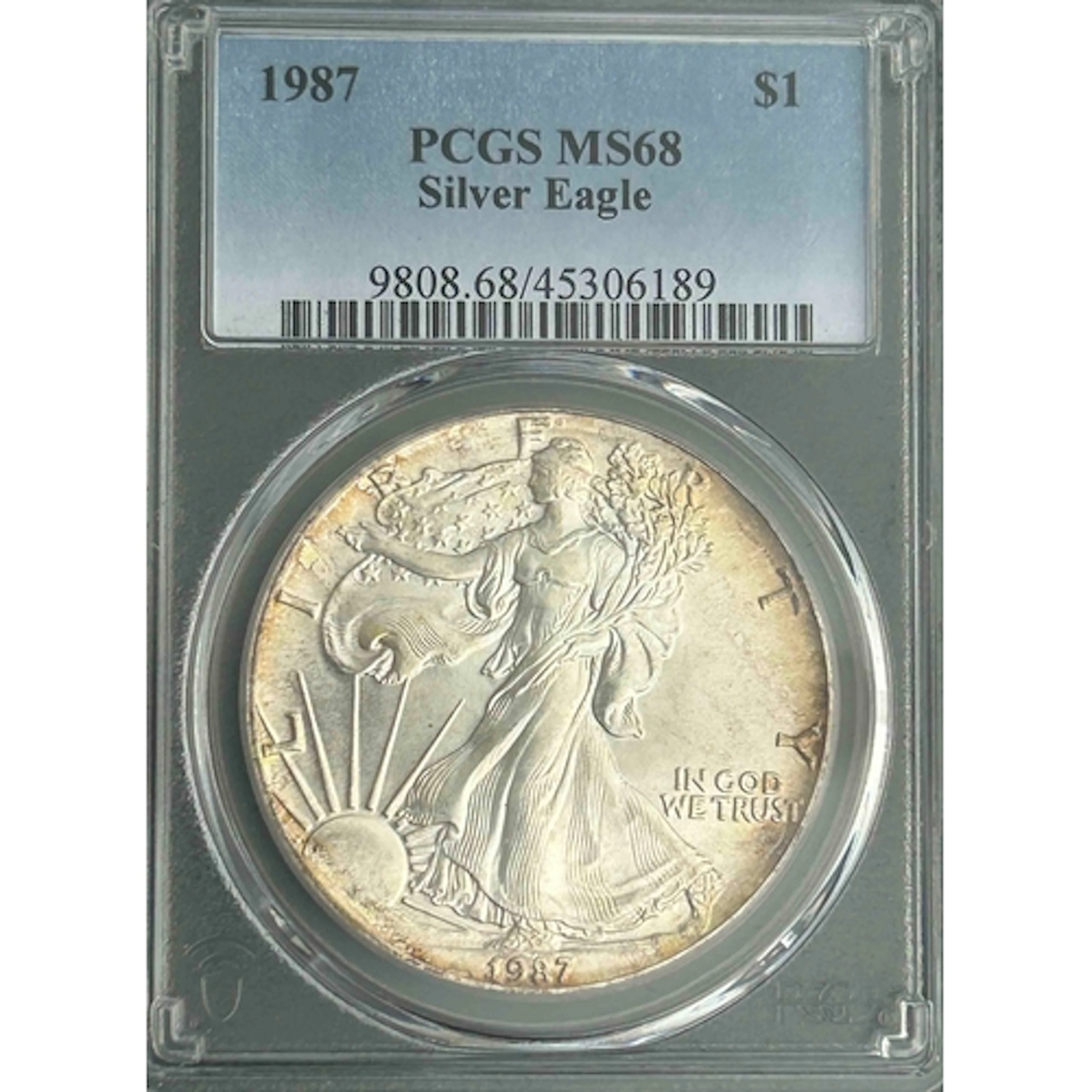 1987 USA $1 silver Eagle coin, slabbed and graded by P.C.G.S...