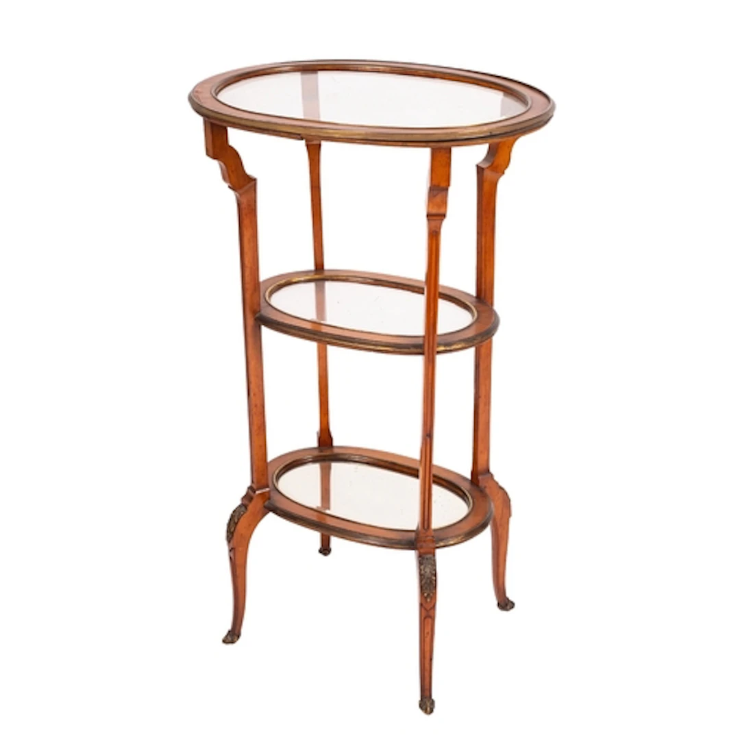 A satinwood and glazed three-tier etagere in Napoleon III ta...