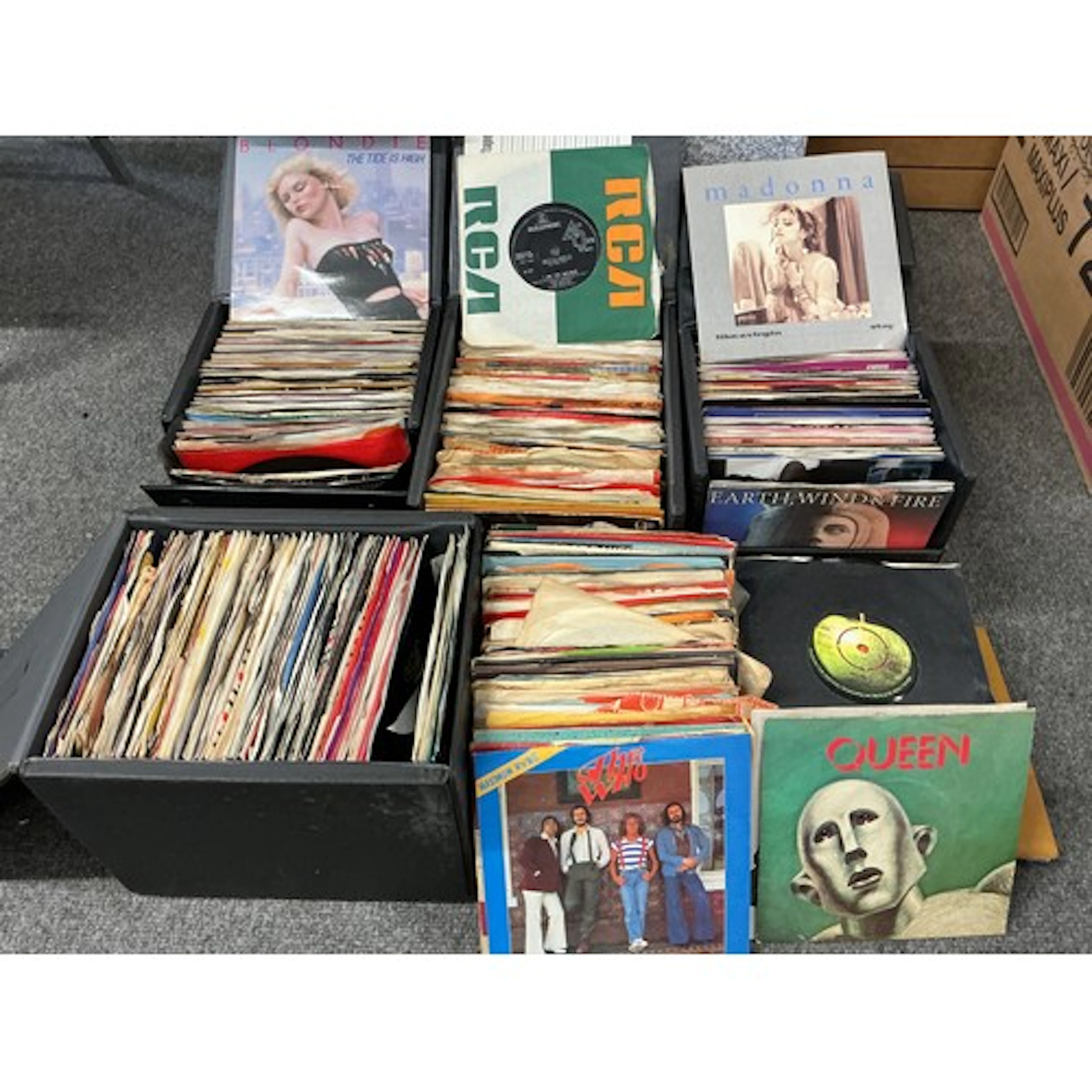 Four record cases and a box of 7” singles by various artists...