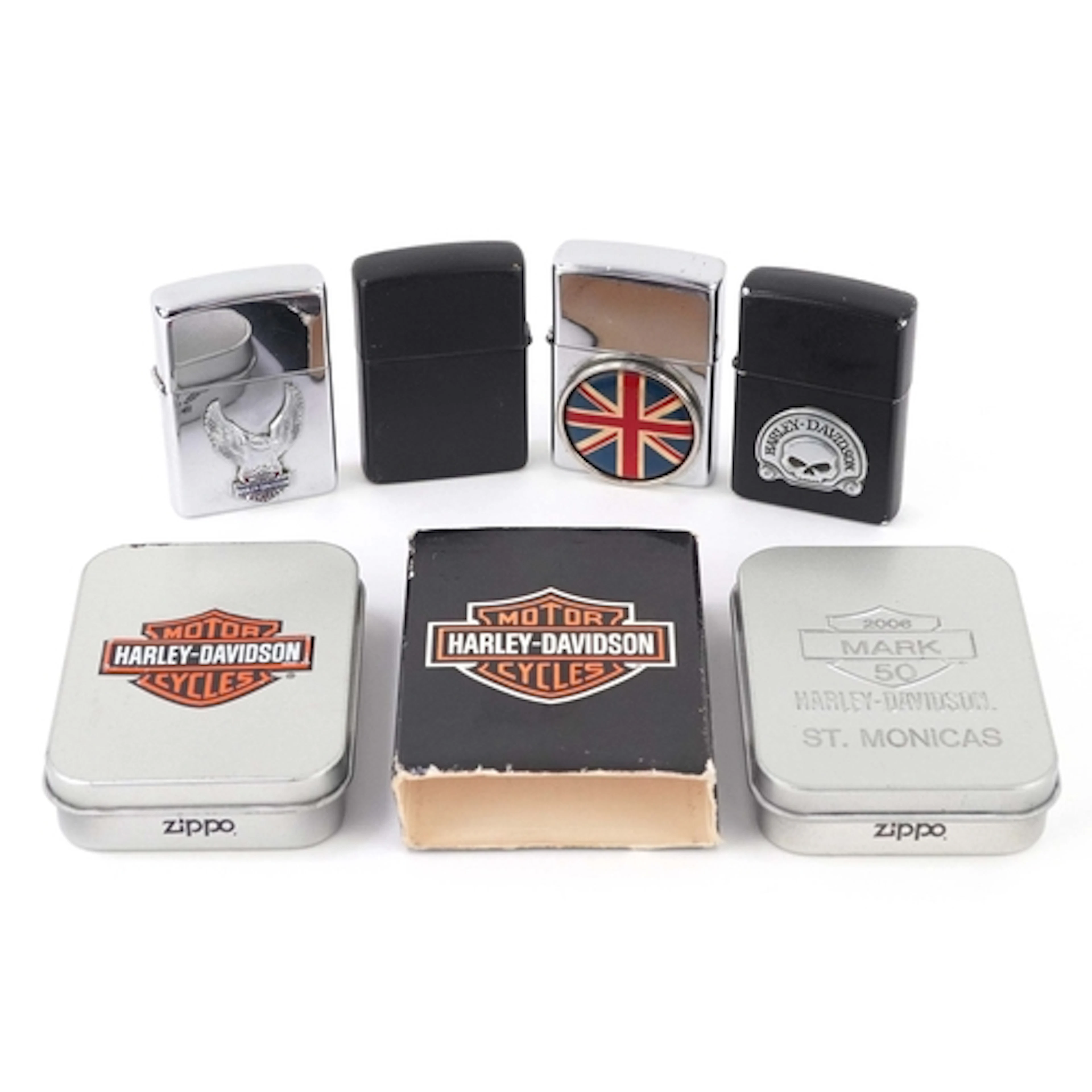 Four vintage and later Zippo pocket lighters including two H...
