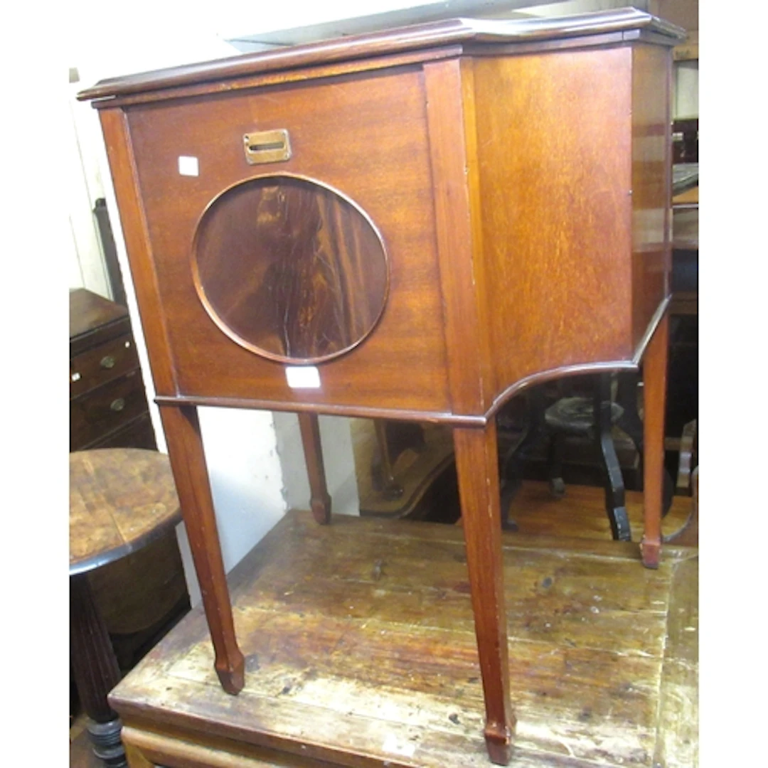 Early 20th Century mahogany drinks cabinet, the shaped bi-fo...
