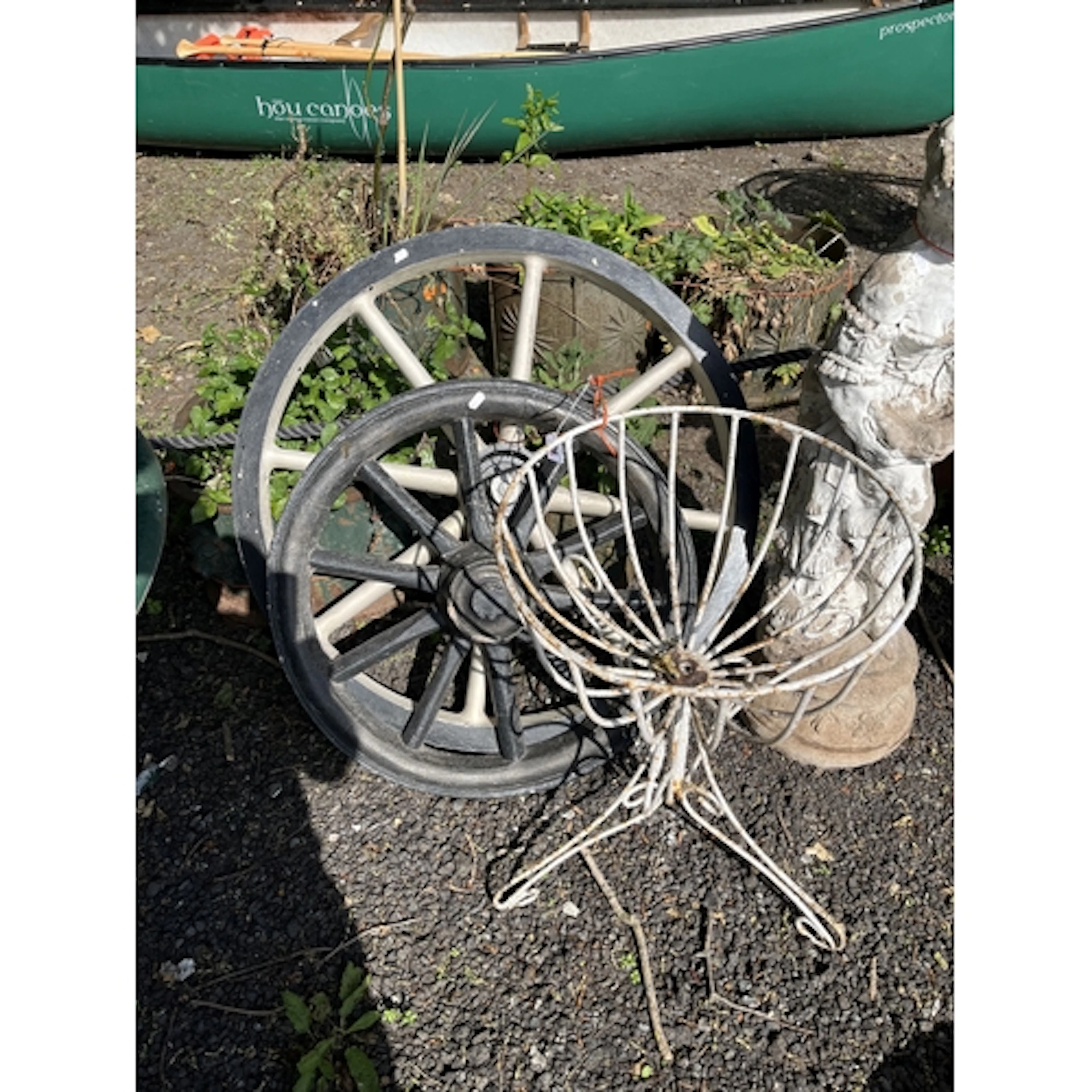 A WIRE FRAMED PEDESTAL PLANTING BASKET, 56cm high, one plast...