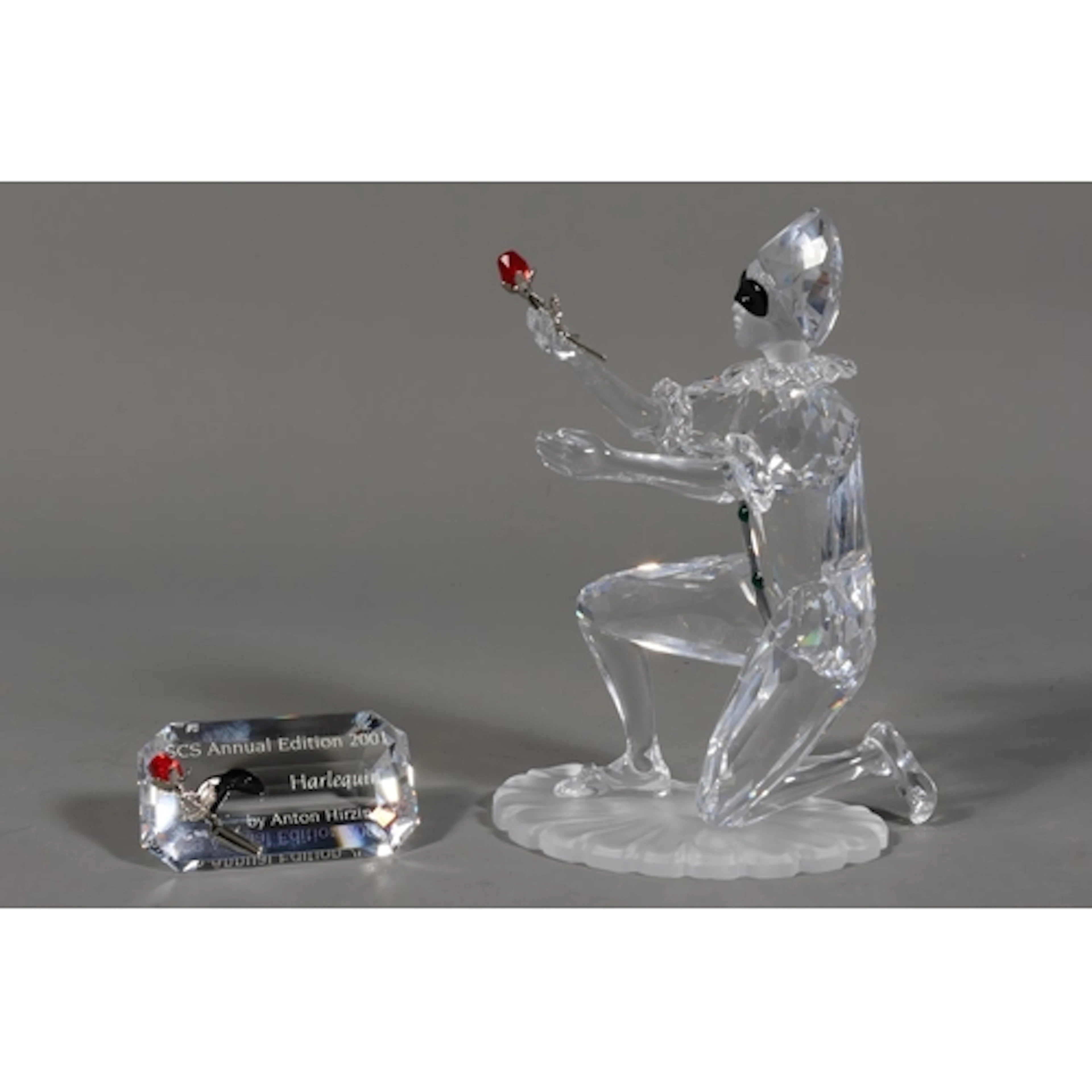 Boxed Swarovski crystal glass sculpture of Masquerade Harleq...
