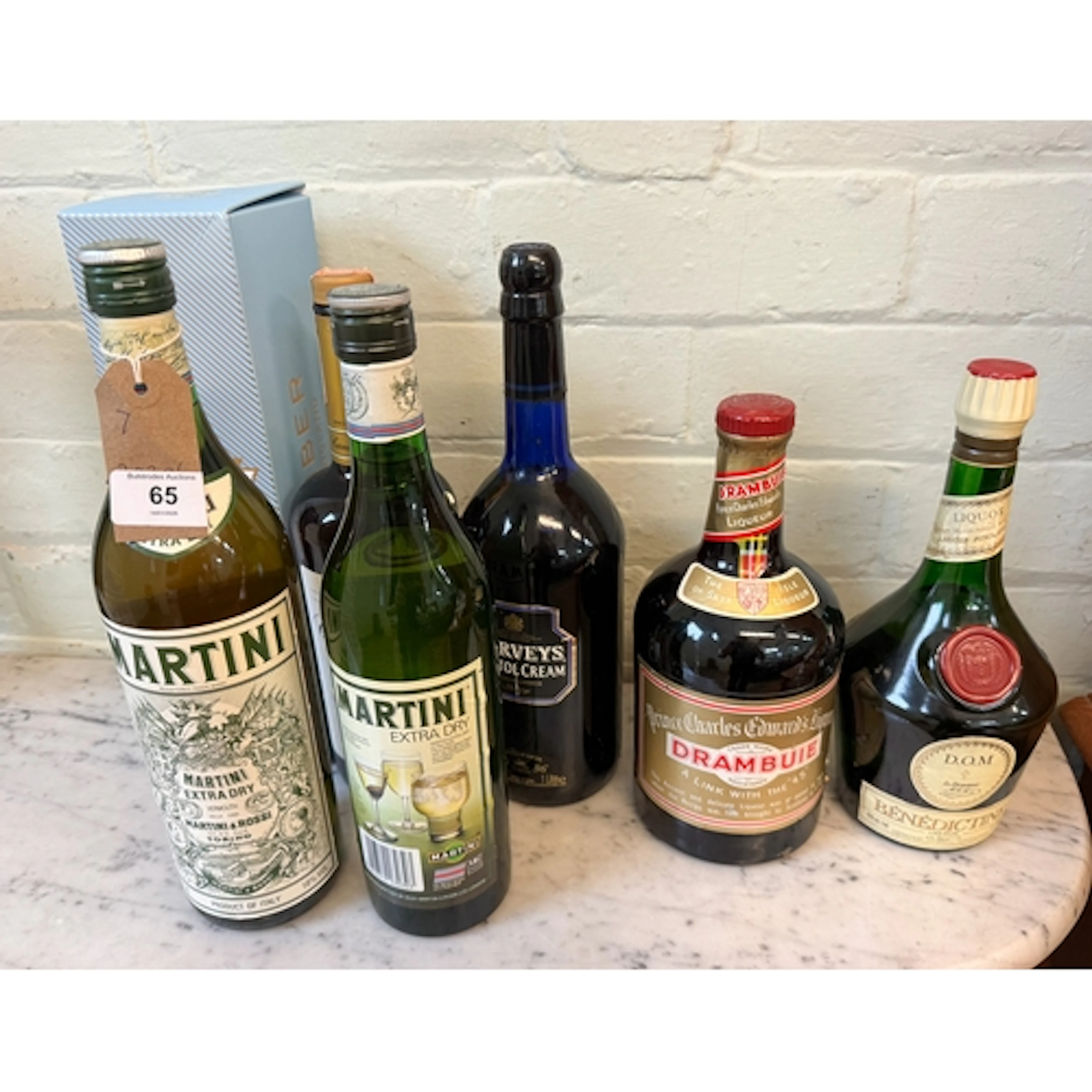 A bottle of Canadian Club together with a bottle of Harvey's...