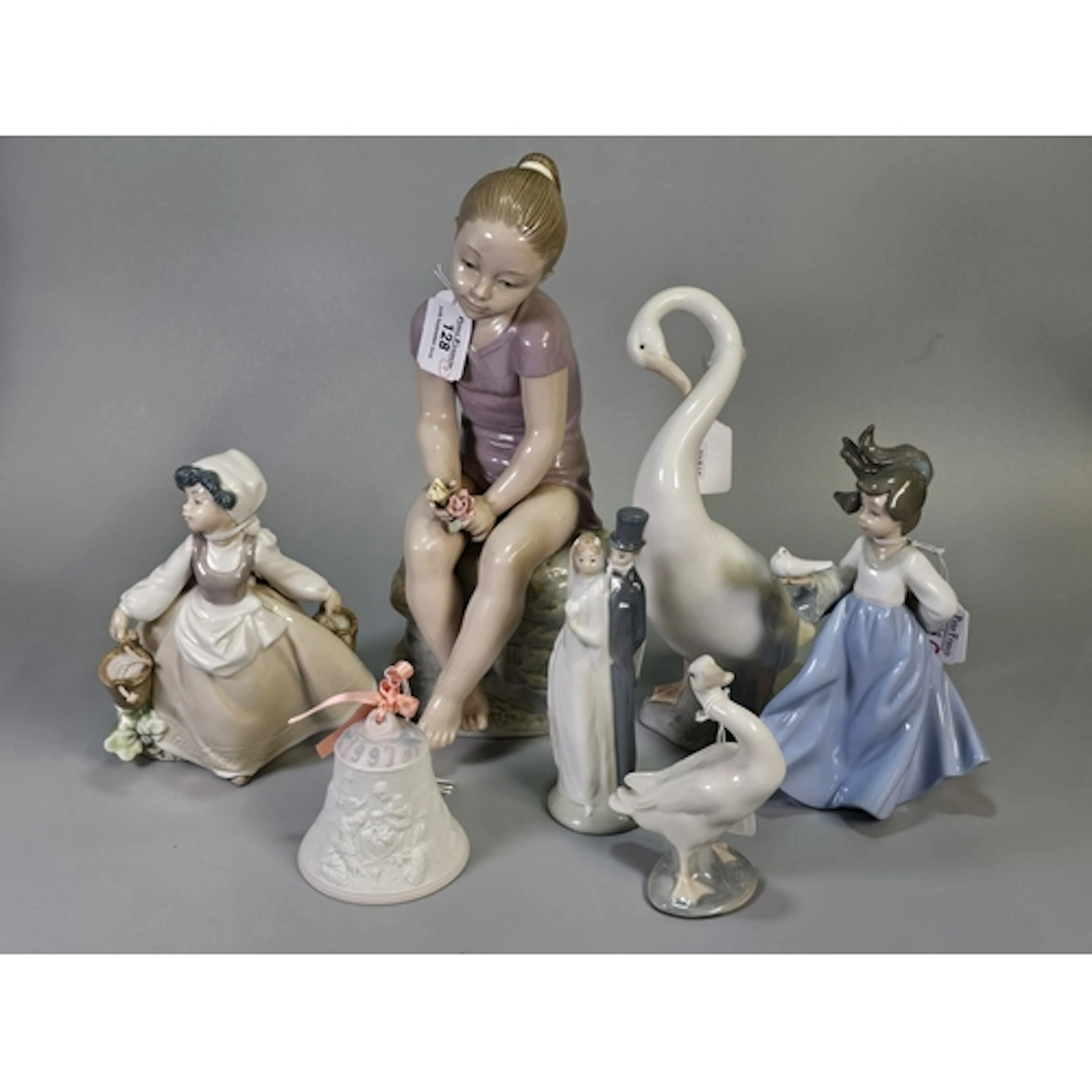 Collection of Lladró and Nao figurines, to include wedding c...