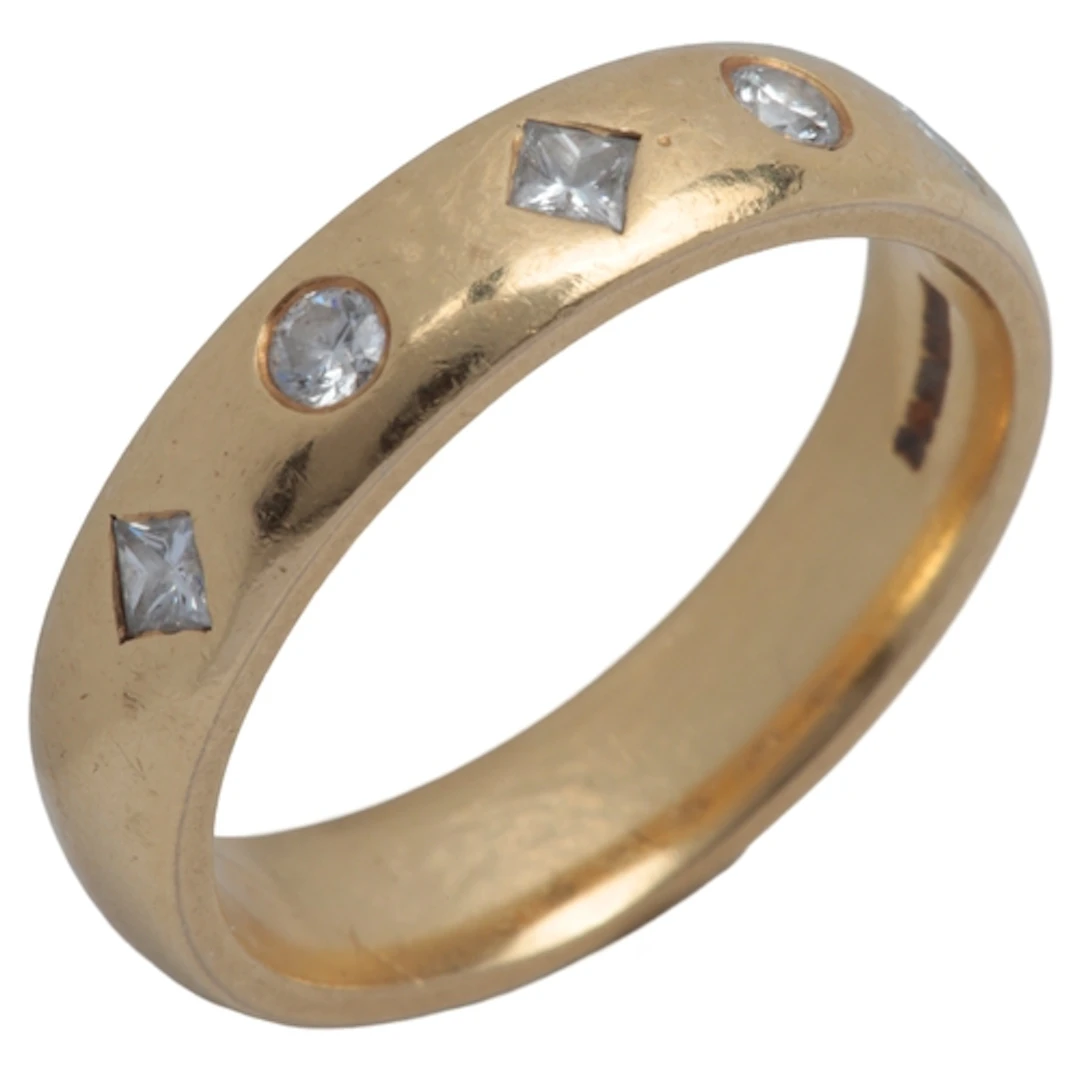 A diamond ring, the gold band rub over-set with a sequence o...