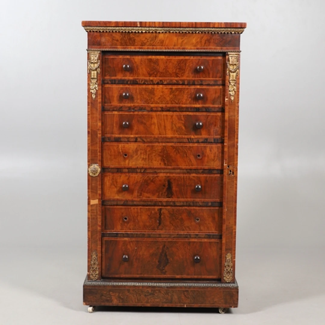 A LOUIS XVI STYLE FIGURED WALNUT WELLINGTON CHEST. 19th cent...