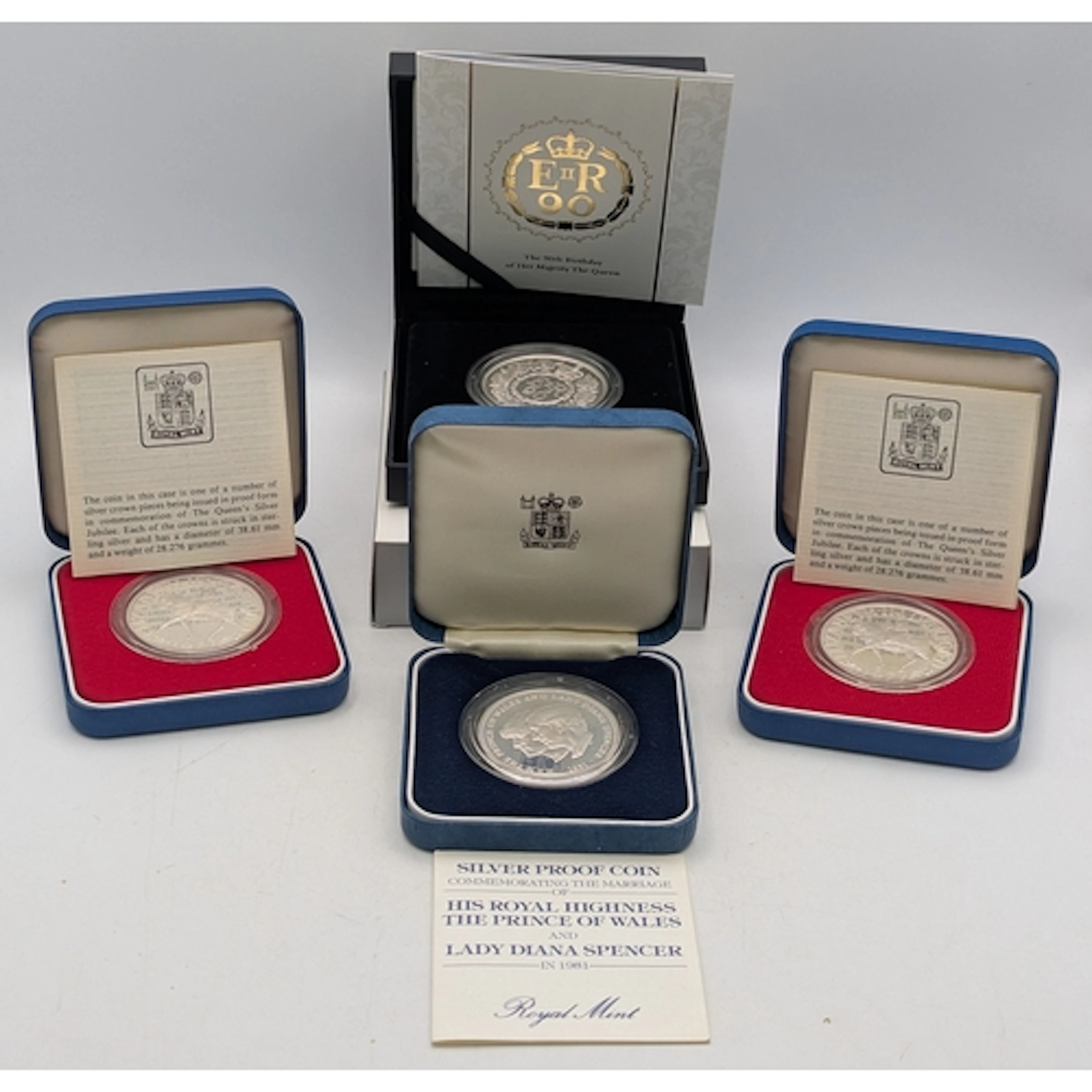 Four silver proof British commemorative coins to include a 9...