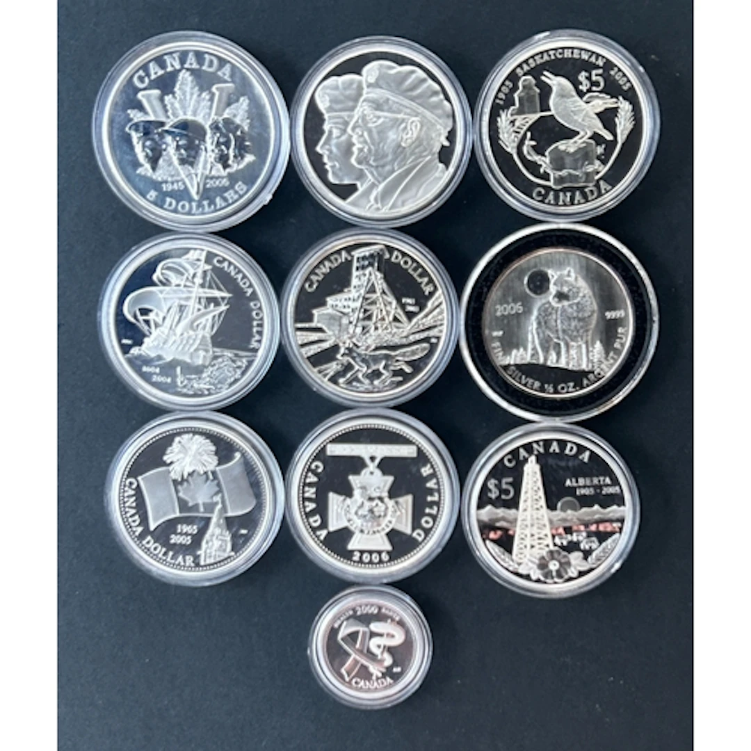 A group of nine Canadian silver coins, comprising silver $1 ...
