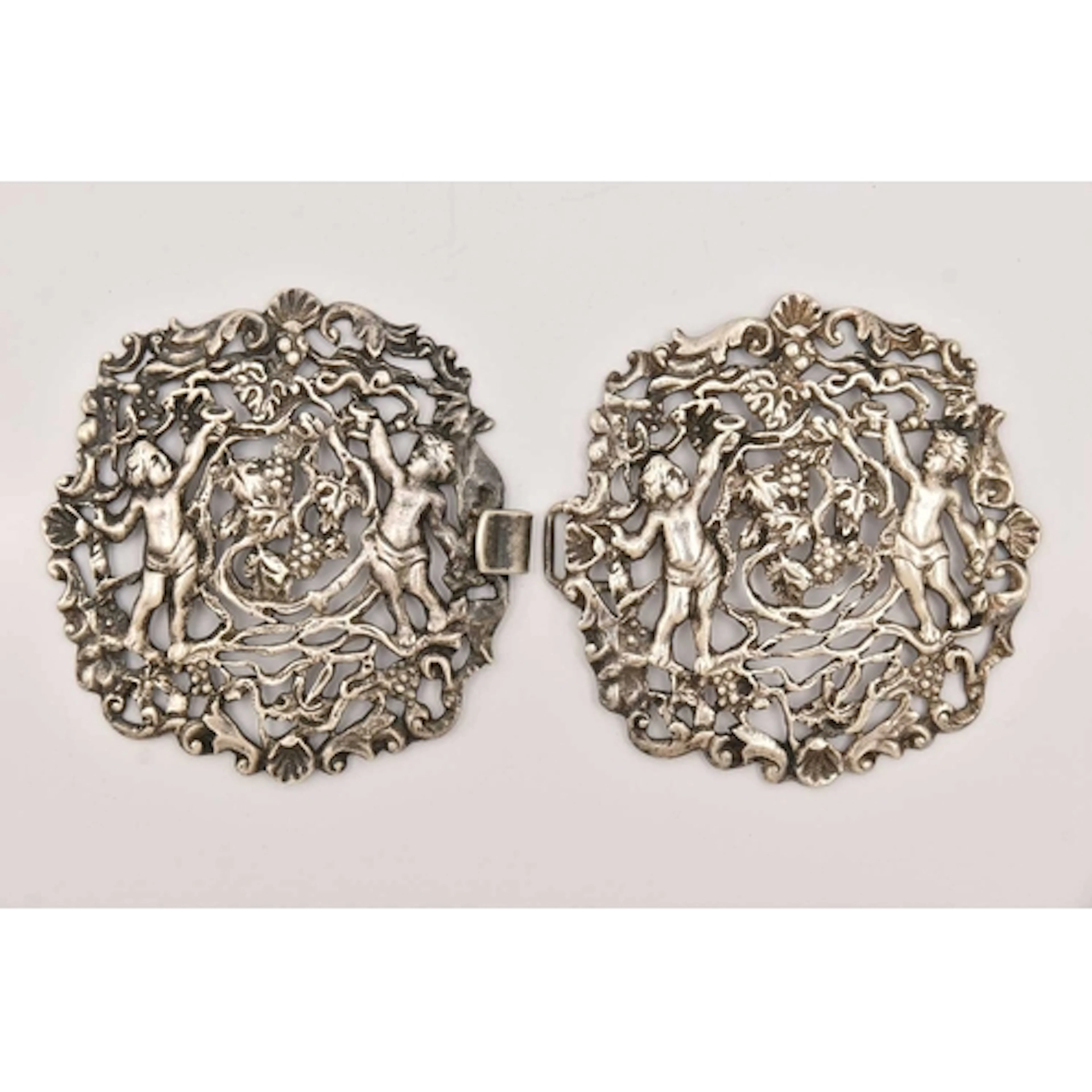 A WHITE METAL NURSES BELT BUCKLE, of an open work design, de...