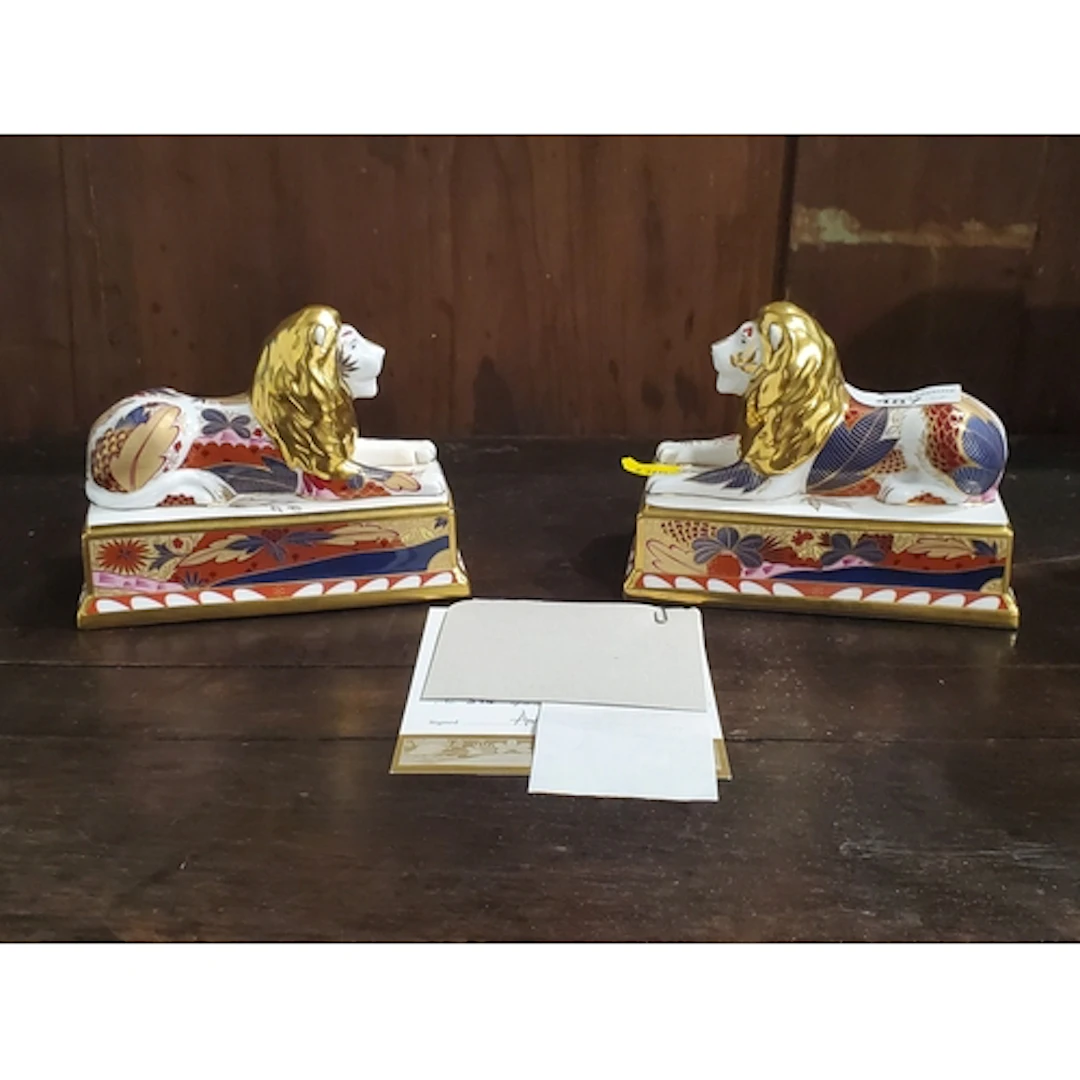 A pair of Royal Crown Derby Nelson Collection 'Trafalgar Lio...