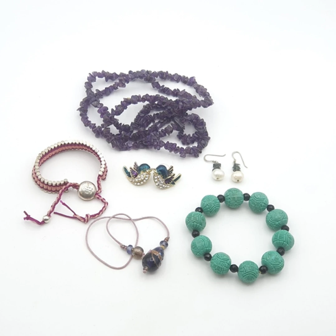 An Amethyst Bead Necklace, a Chinese carved Bead Bracelet, c...