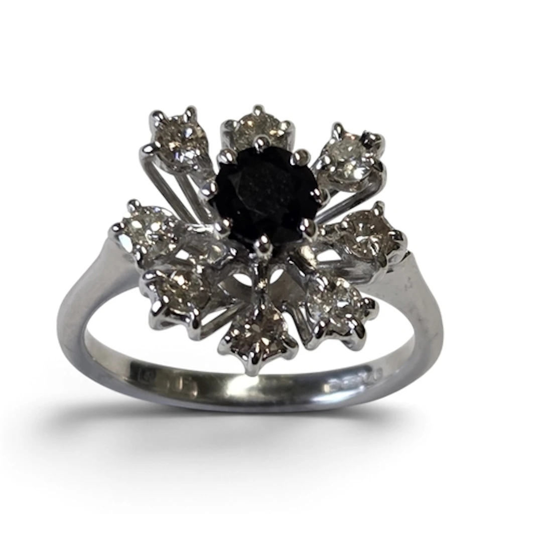 An 18ct Gold, Diamond and Sapphire cluster Ring size K.