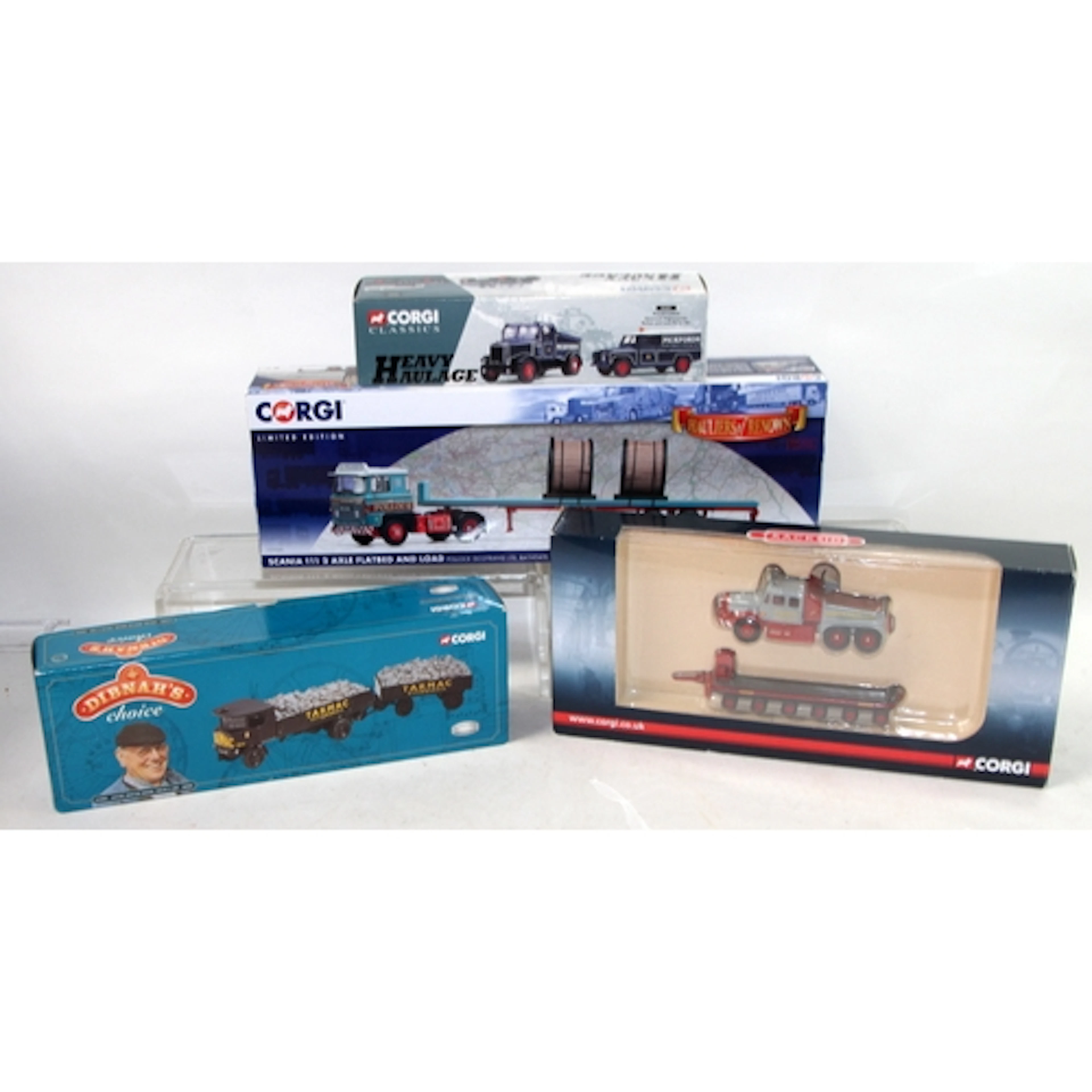 A small collection of boxed die-cast model vehicles includin...