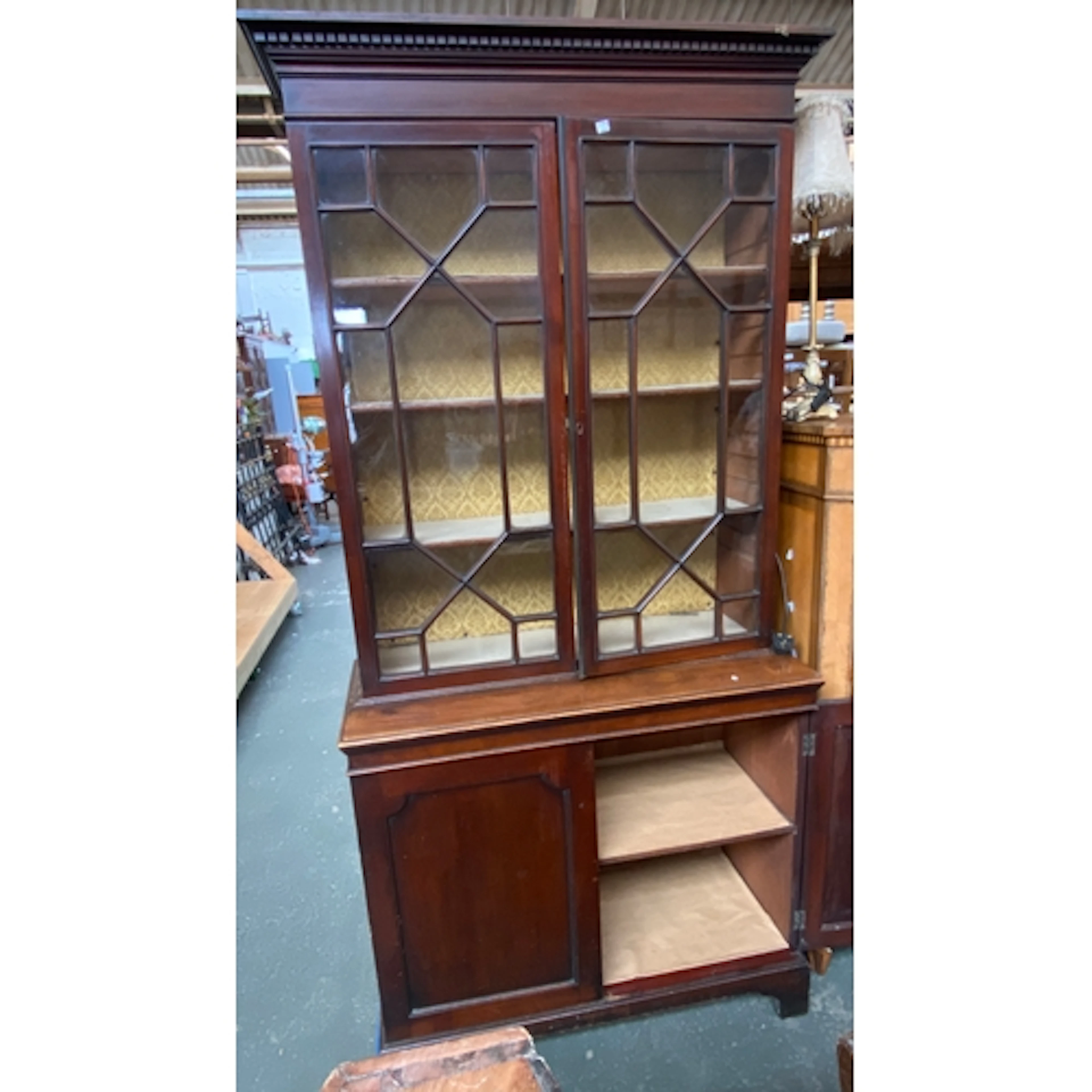 A astragal glazed library bookcase cabinet with dentil corni...